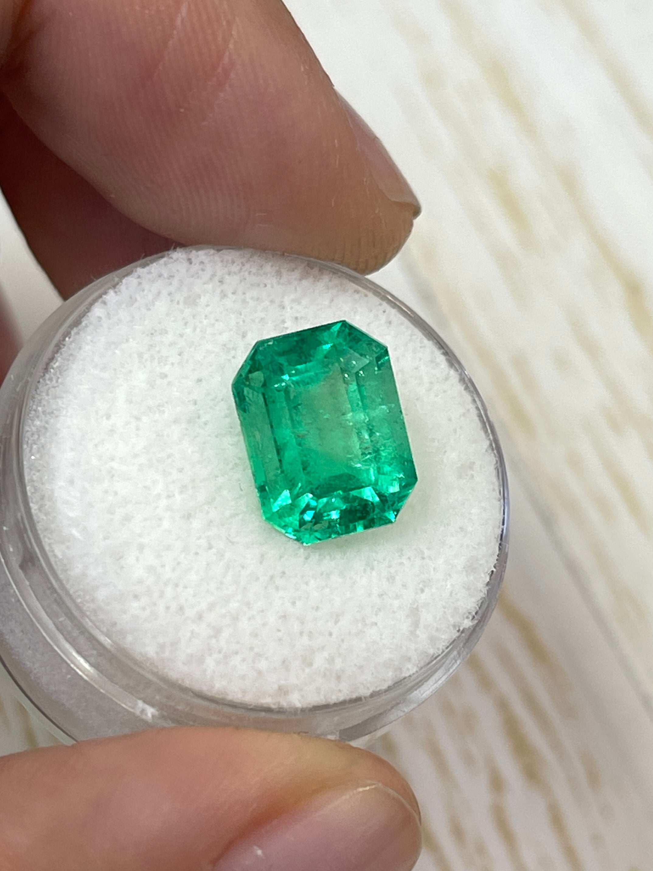 4.70 carat yellowish green natural Colombian emerald loose gemstone in classic emerald cut, from JR Colombian Emeralds.