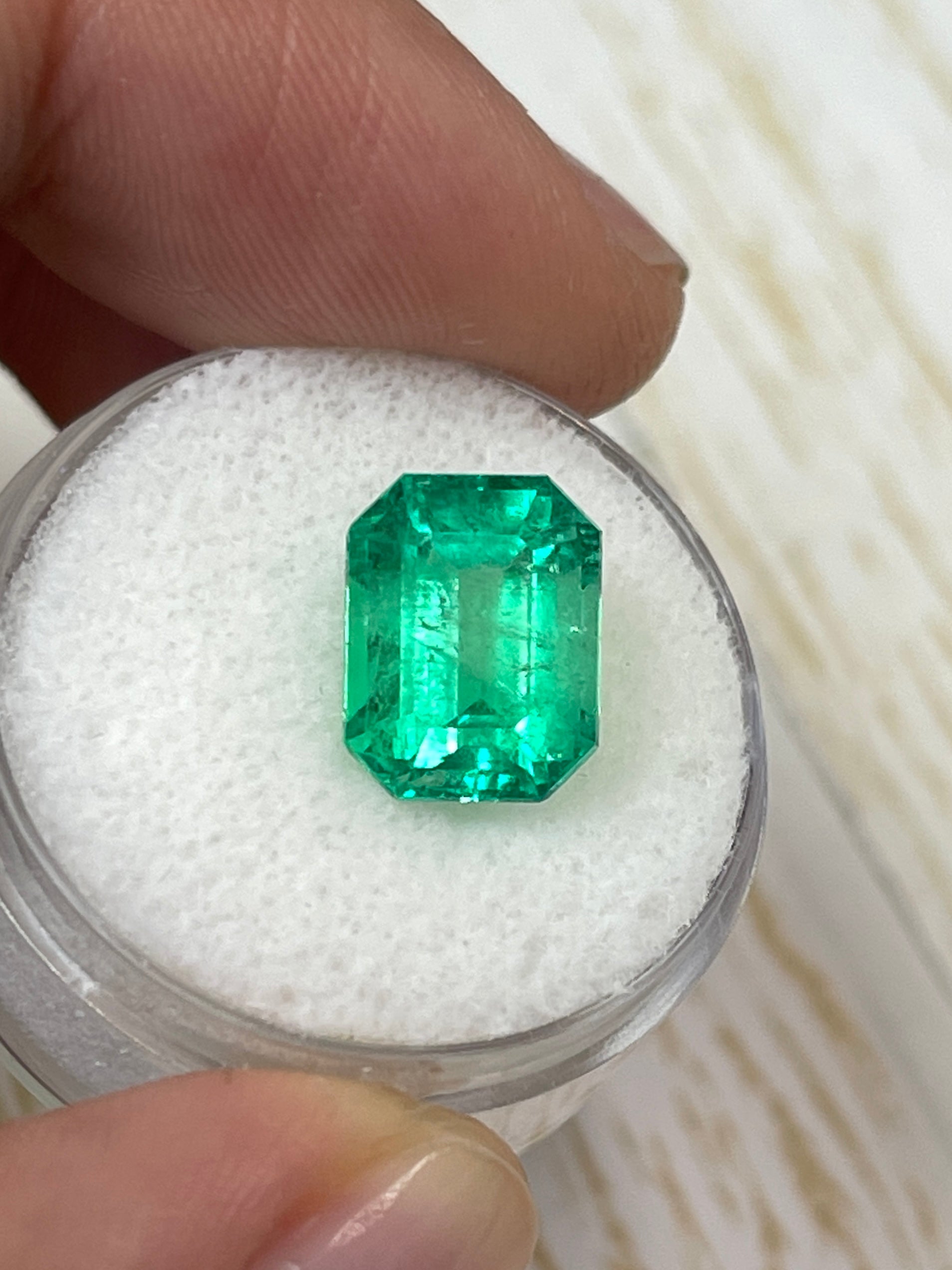 4.70 carat yellowish green natural Colombian emerald loose stone in classic emerald cut, from JR Colombian Emeralds.