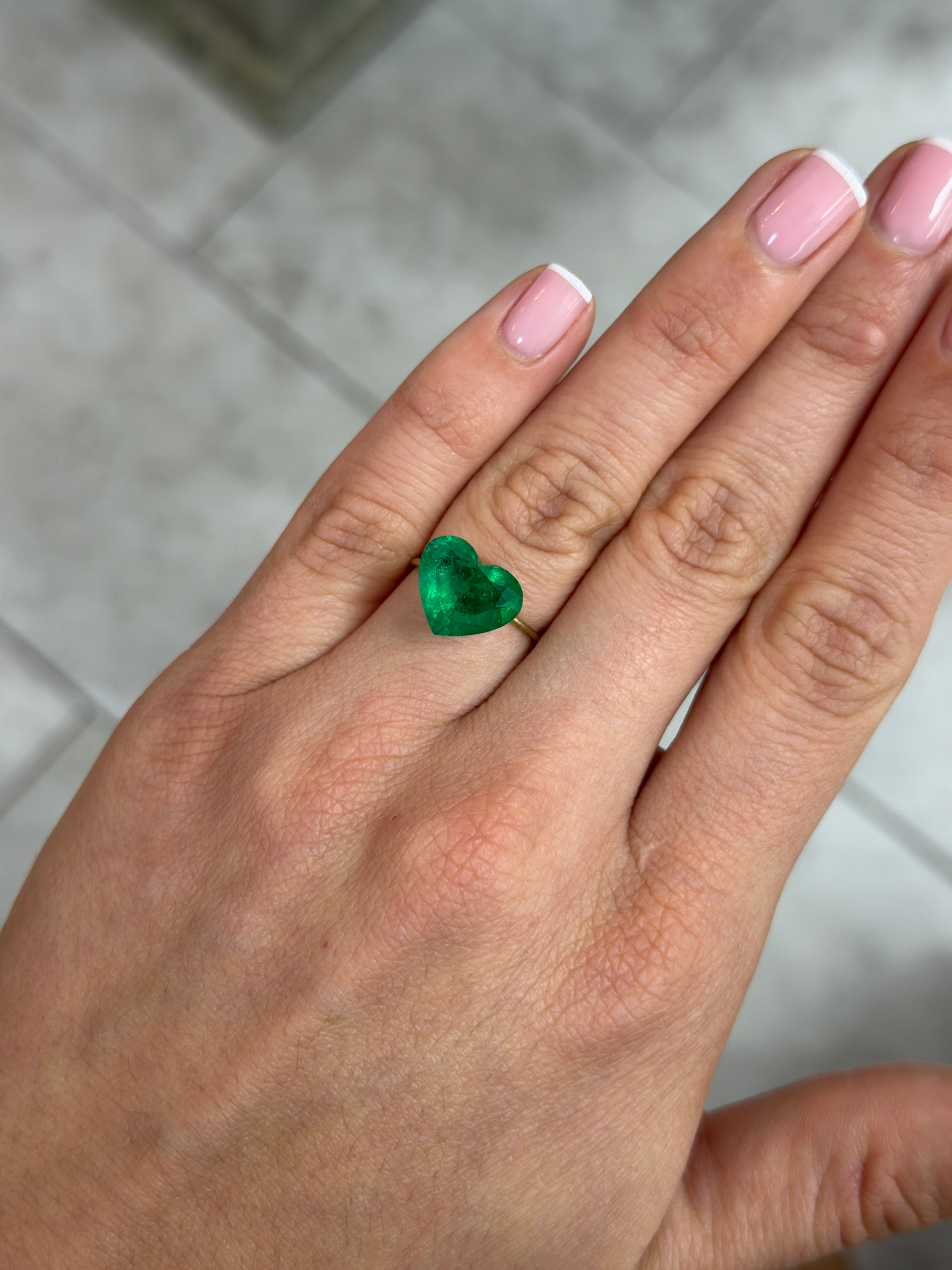 4.79 carat 11x13mm AAA+ intense green natural Colombian emerald loose gemstone in heart cut, from JR Colombian Emeralds.