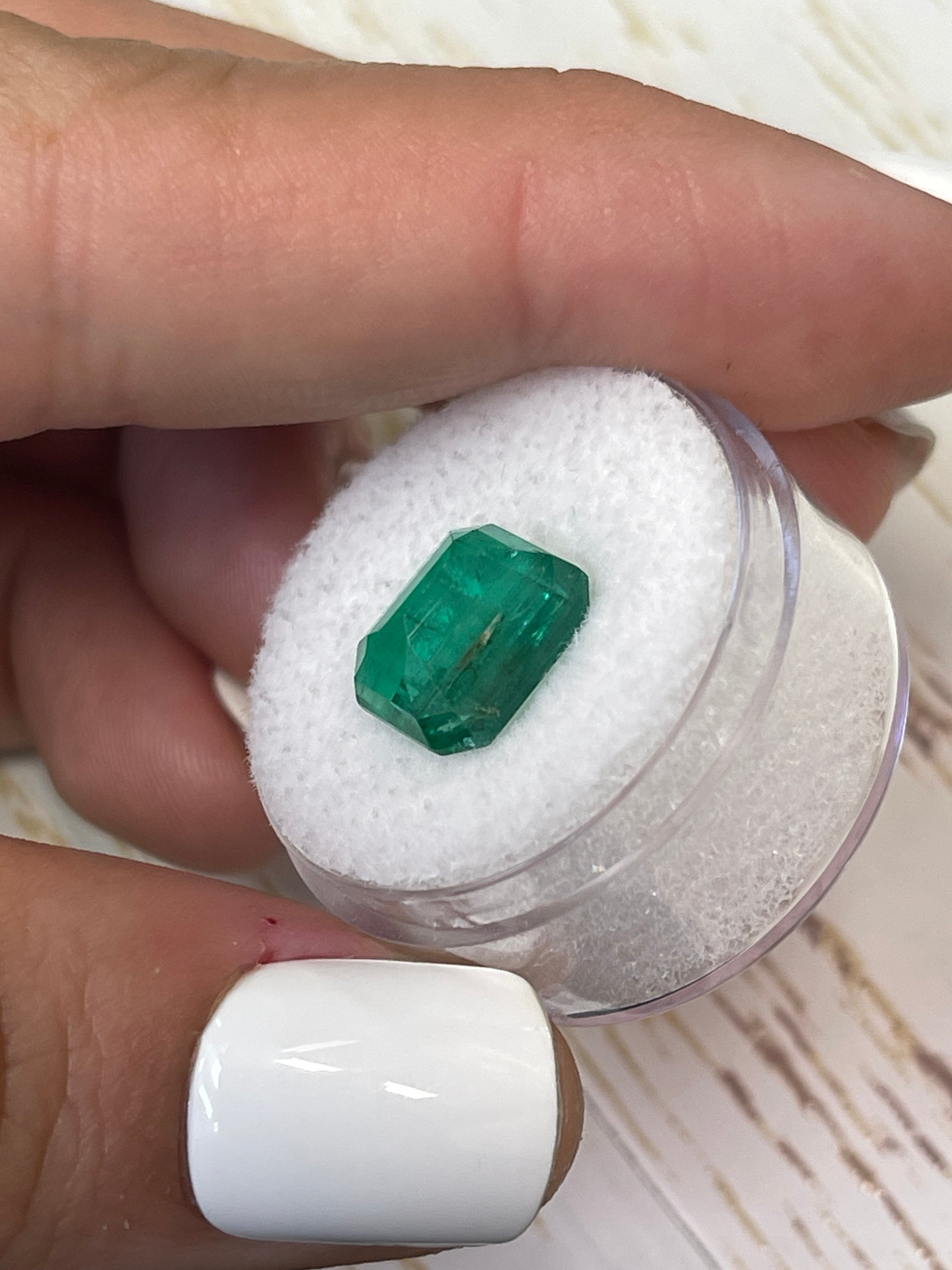 4.81 carat medium green Zambian emerald cut loose gemstone by JR Colombian Emeralds, showcasing a natural vivid green color.