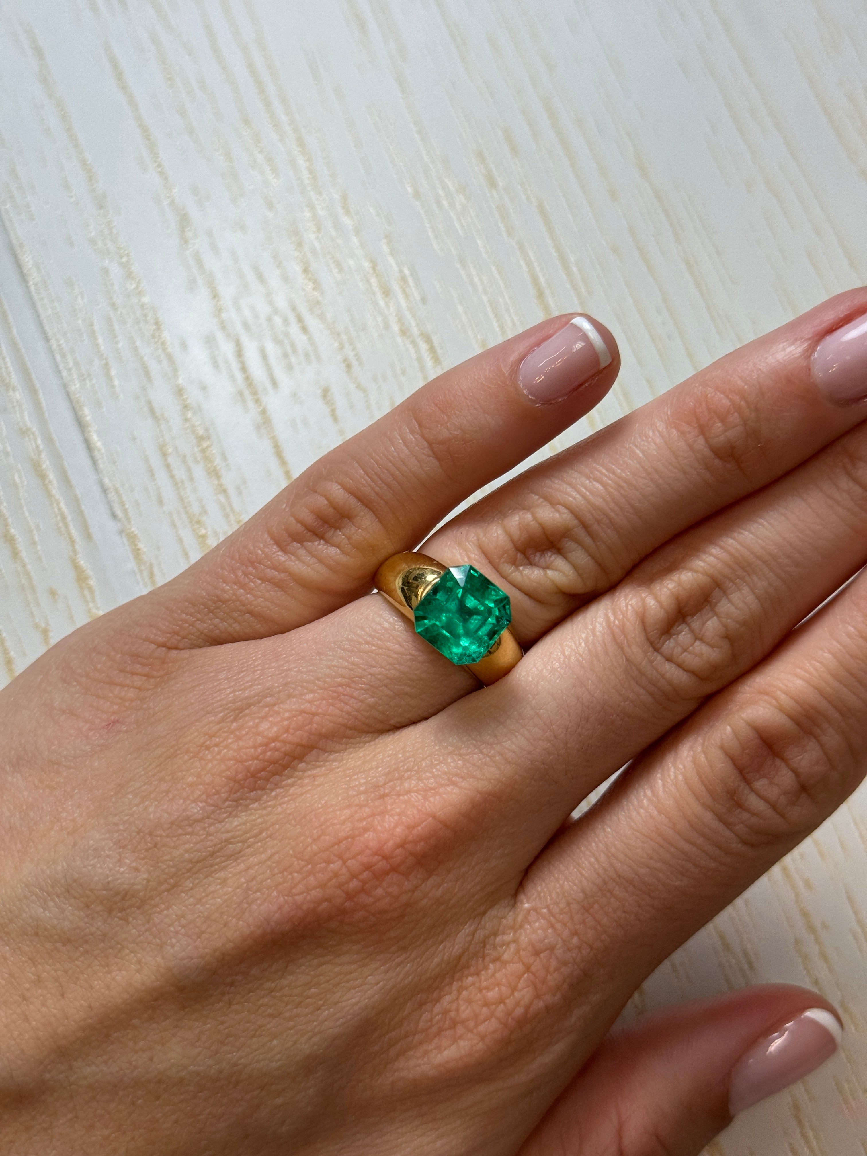 4.83 carat bluish Colombian emerald in Asscher cut, loose gemstone from JR Colombian Emeralds, showcasing deep blue-green hues.