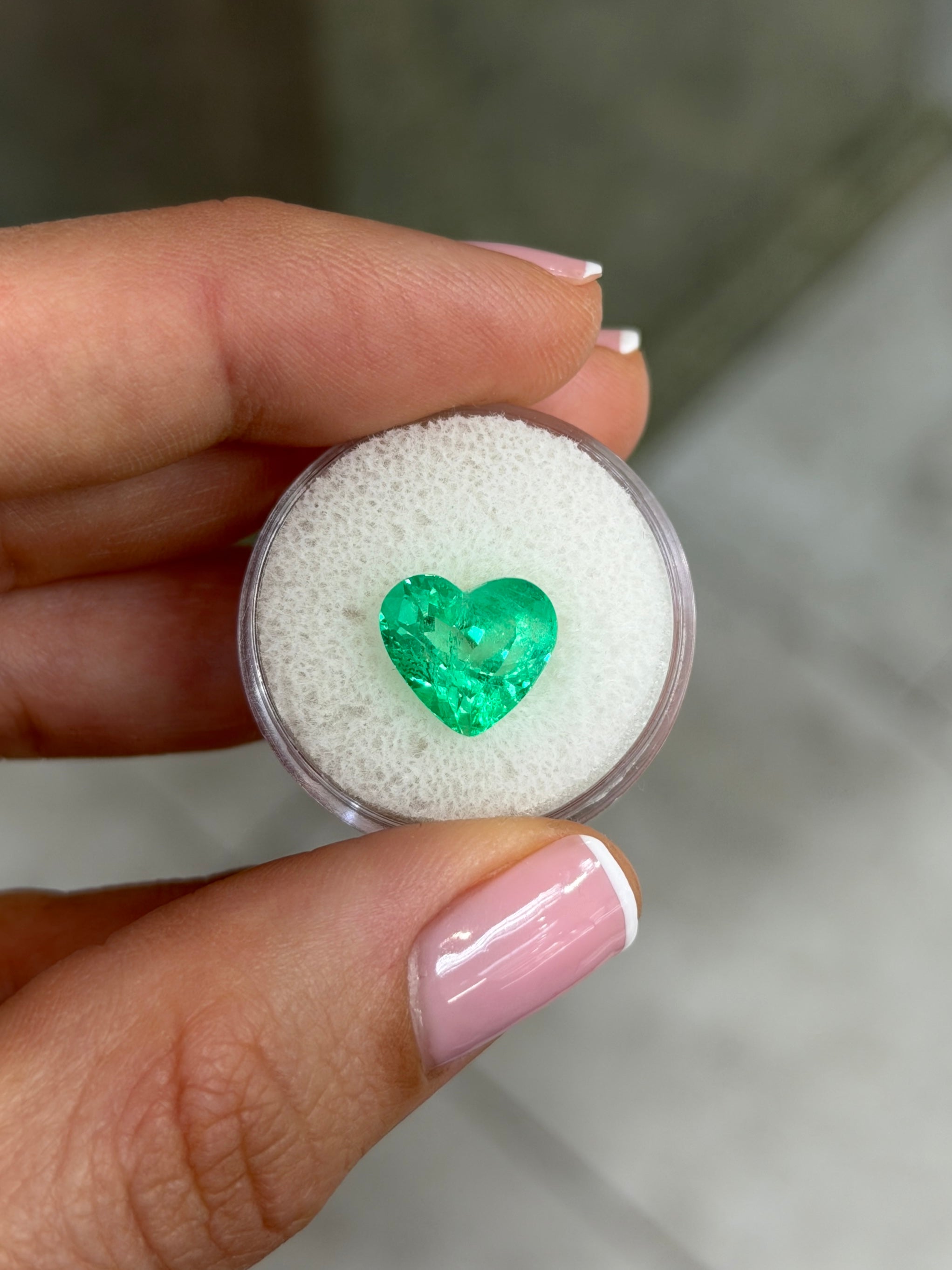 Natural loose Colombian emerald, 4.83 carats, 10x11 mm, electric green, heart cut, glowing and radiant from JR Colombian Emeralds.
