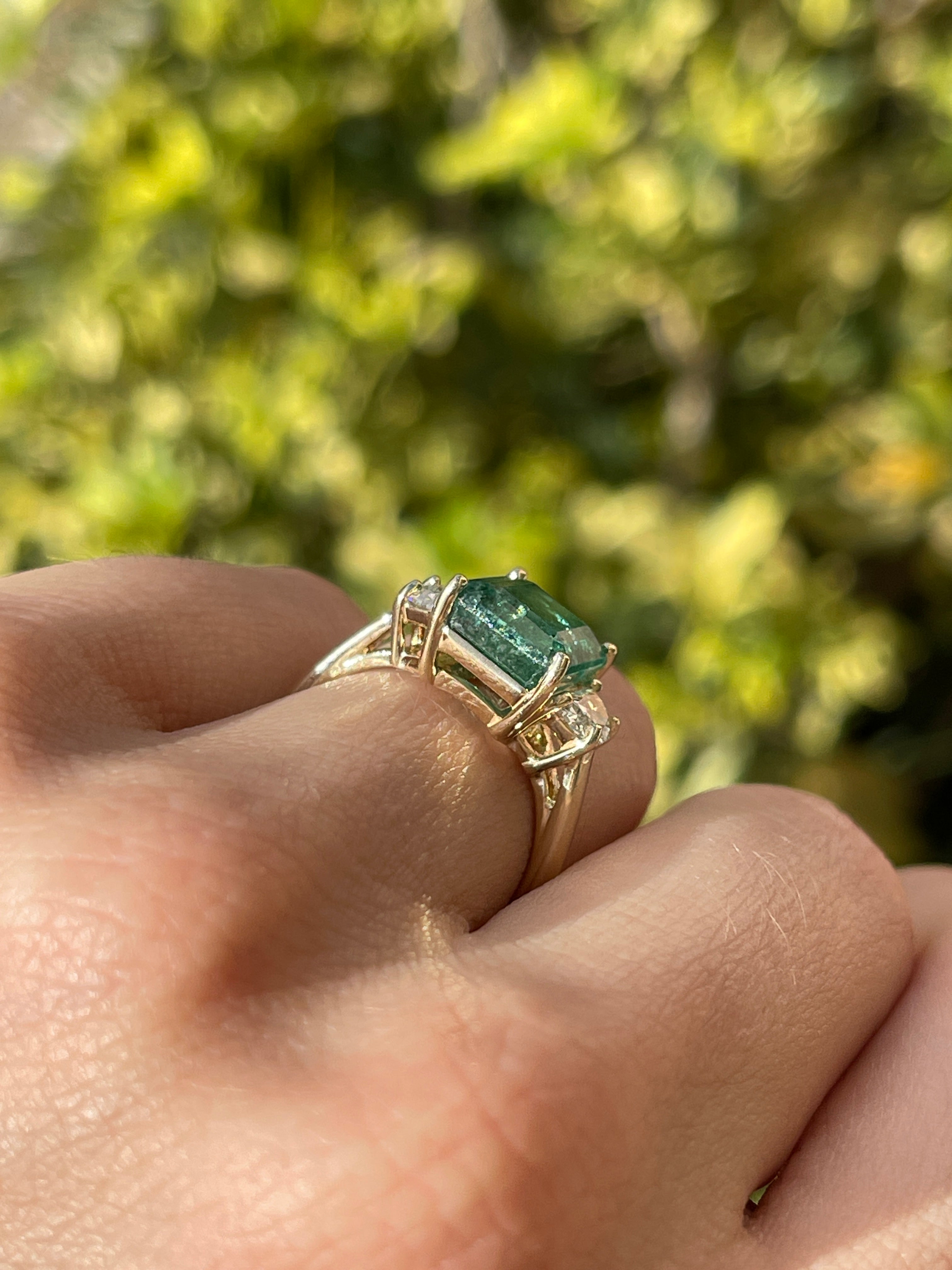 14K three-stone ring featuring a 4.88tcw natural emerald and lab-grown half moon diamonds by JR Colombian Emeralds