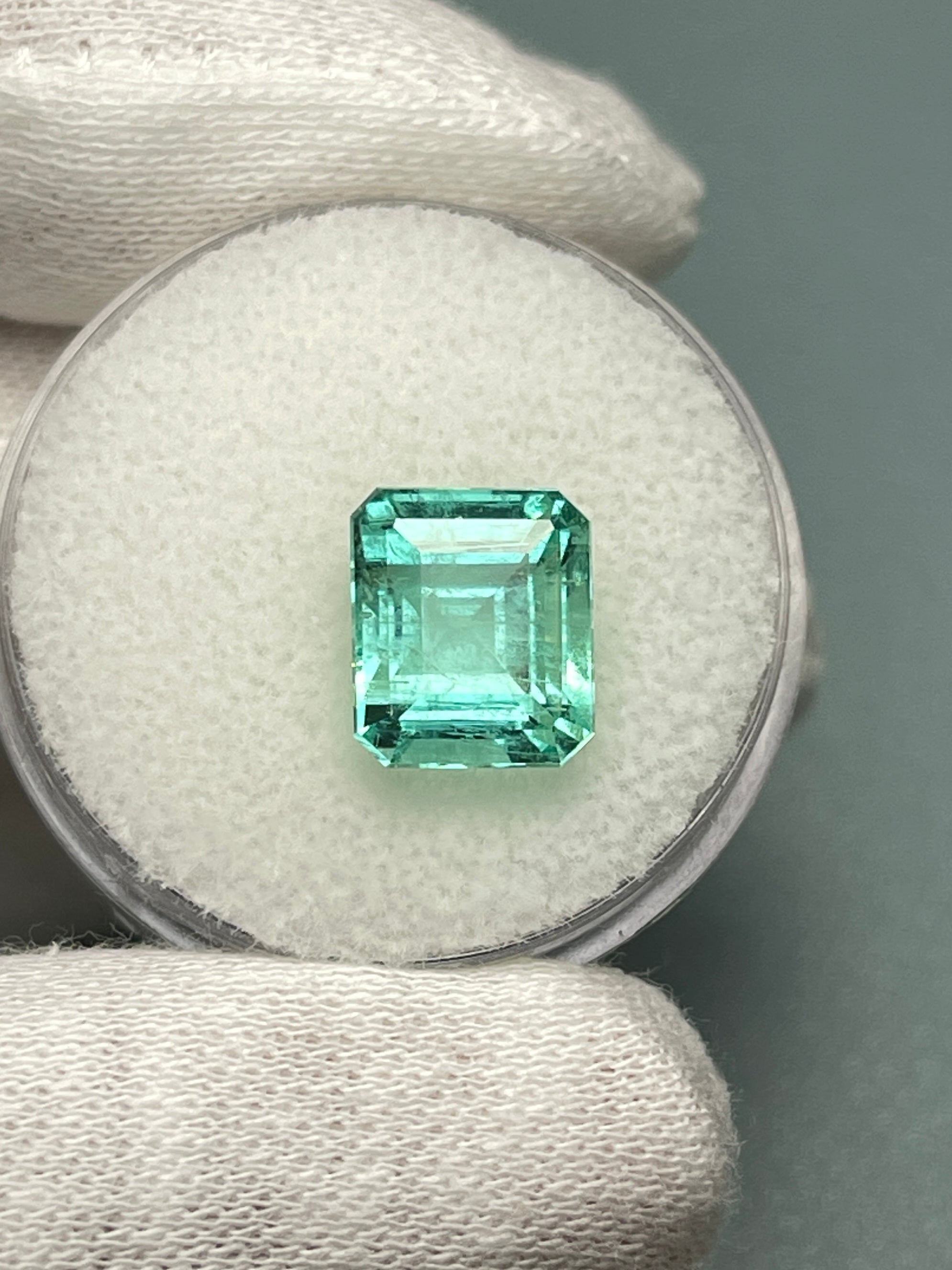 Natural 4.91 carat Colombian emerald loose gemstone in 10x8.5 mm emerald cut, pastel bluish green color, from JR Colombian Emeralds.