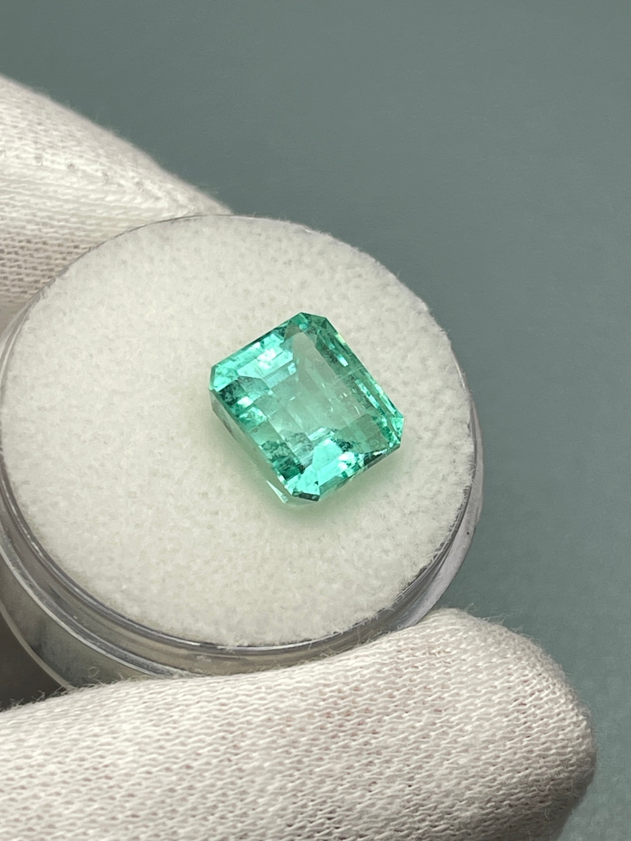Natural 4.91 carat Colombian emerald loose gemstone in emerald cut with chunky pastel bluish-green color, from JR Colombian Emeralds.