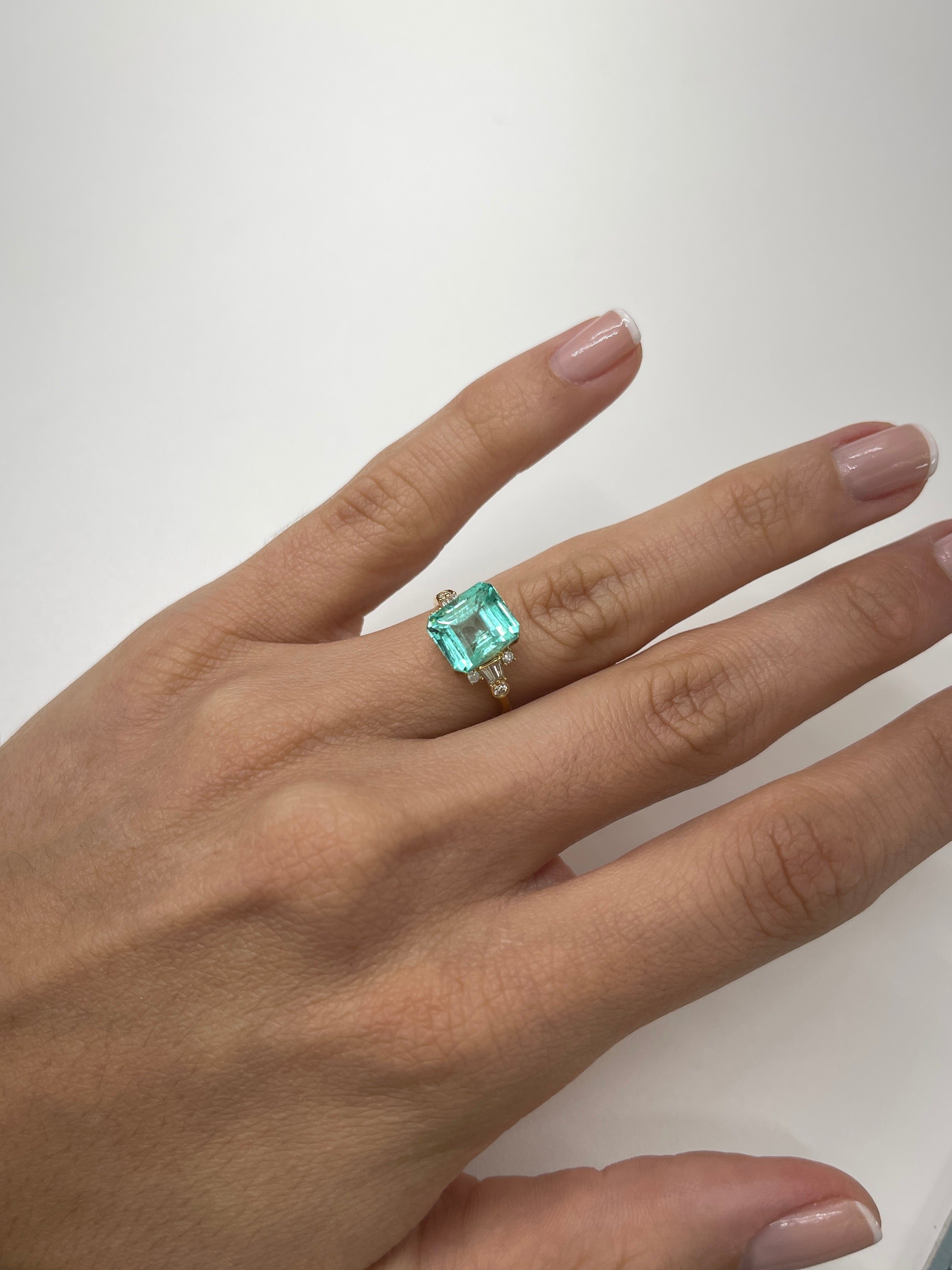 4.91 carat natural Colombian emerald loose gemstone in 10x8.5mm emerald cut with pastel bluish-green color, from JR Colombian Emeralds.