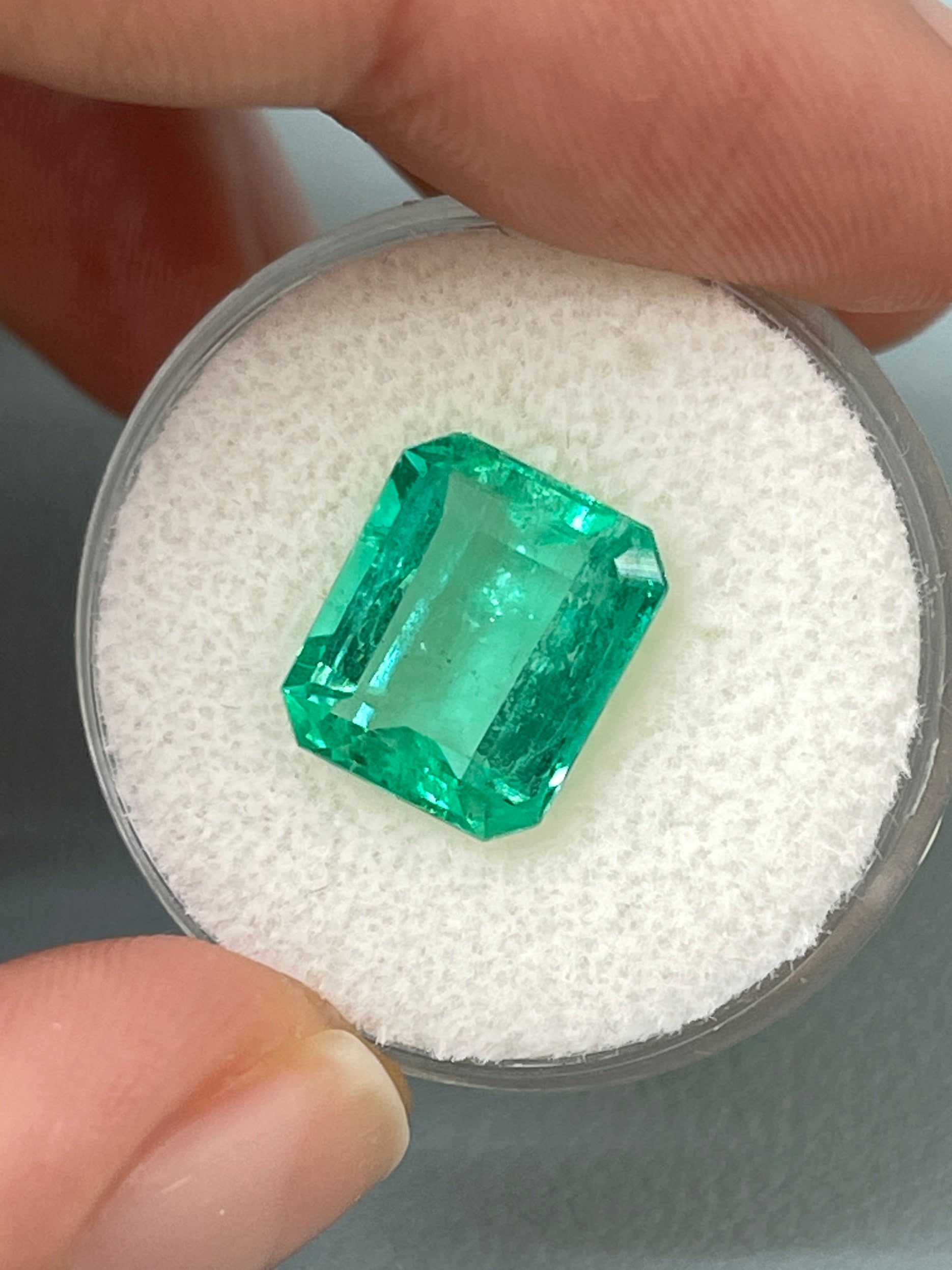 Crystalline 5.02 carat Colombian emerald loose gemstone in classic emerald cut, 11.5x9 mm, from JR Colombian Emeralds.