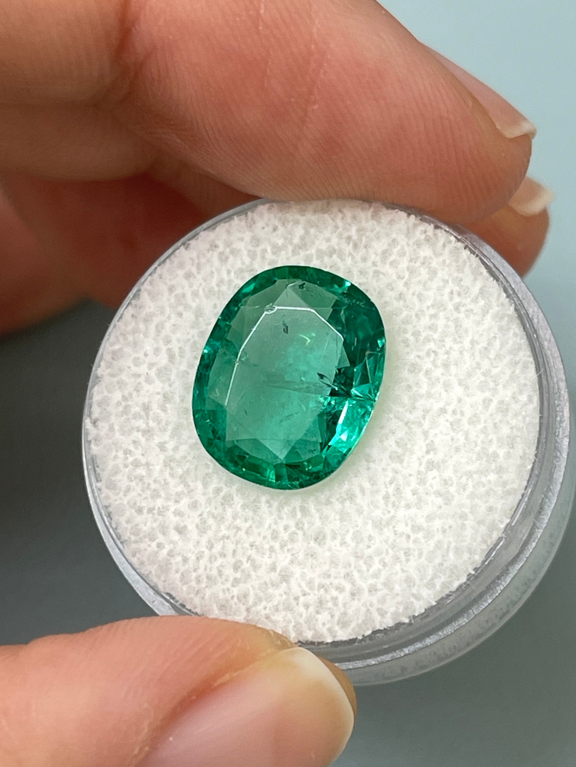 Natural loose Zambian emerald, 5.09 carats, hybrid cushion and oval cut, vibrant green gemstone from JR Colombian Emeralds.