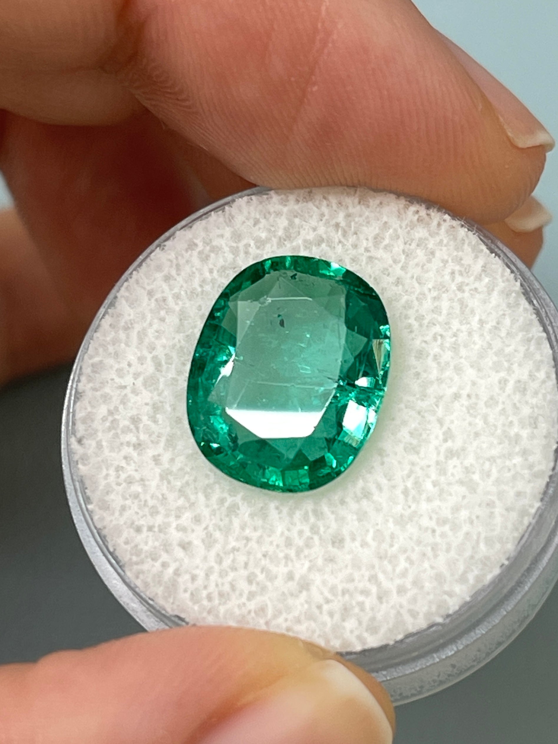 5.09 carat natural Zambian emerald loose gemstone with bubbly hybrid cushion and oval cut, by JR Colombian Emeralds.