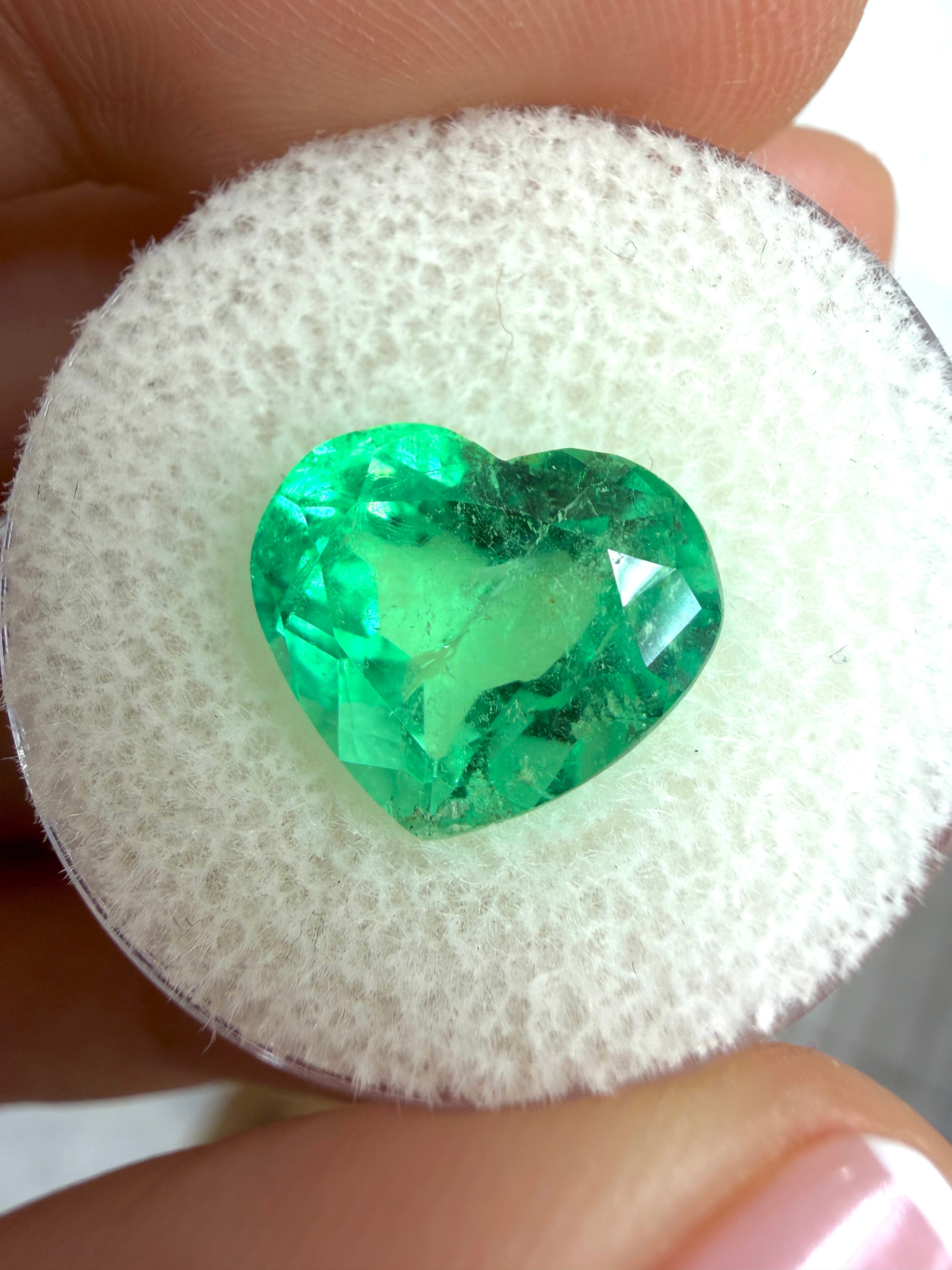 Natural 5.19 carat electric green Colombian emerald loose heart cut from JR Colombian Emeralds, showcasing vibrant chromatic color.