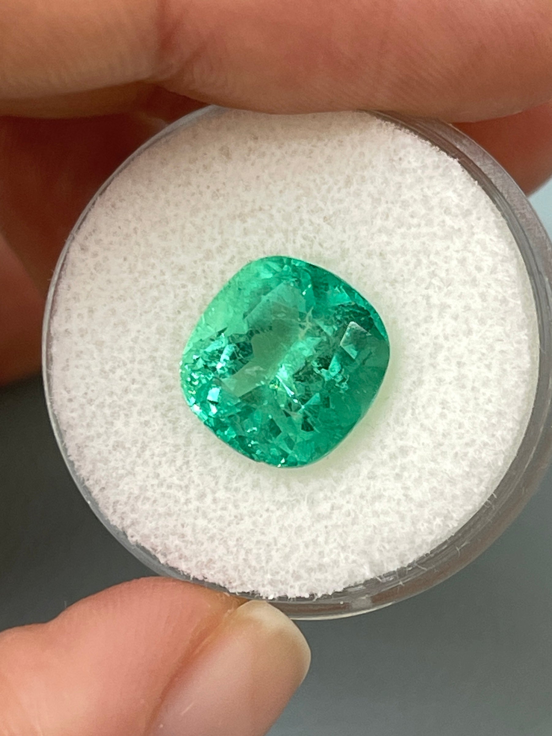 Bright bluish green 5.20 carat natural Colombian emerald in cushion cut, loose gemstone from JR Colombian Emeralds.