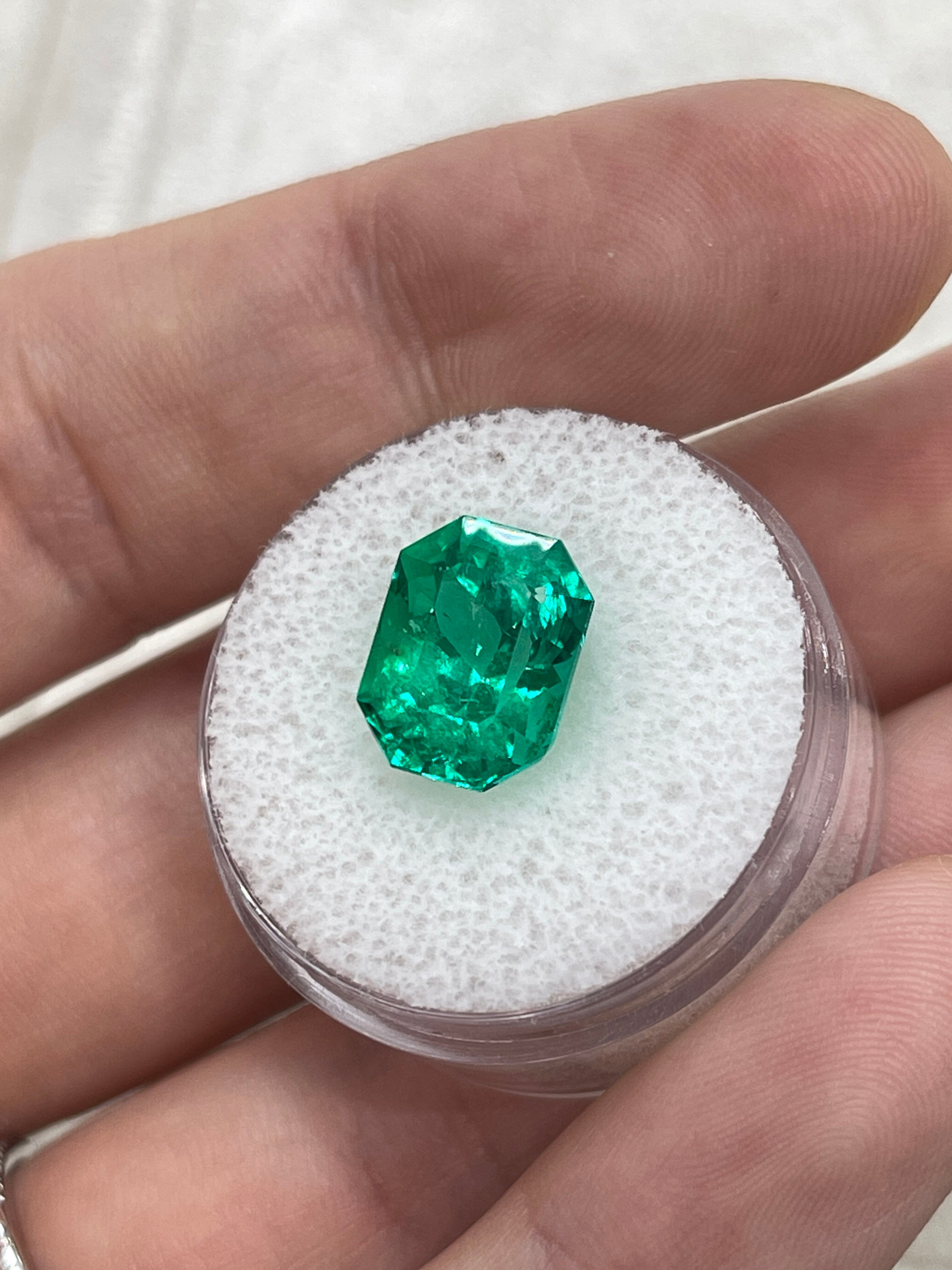 Vivid bluish green 5.21 carat Colombian emerald cut emerald with clipped corners, from JR Colombian Emeralds.