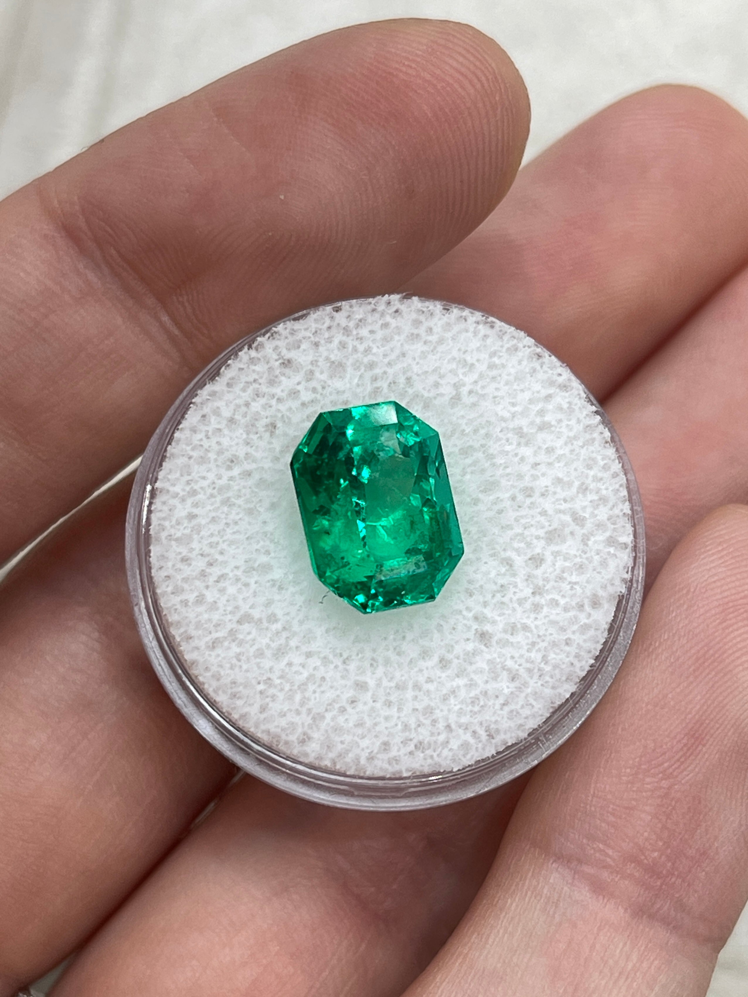Vivid bluish green Colombian emerald cut gemstone weighing 5.21 carats with clipped corners, from JR Colombian Emeralds.