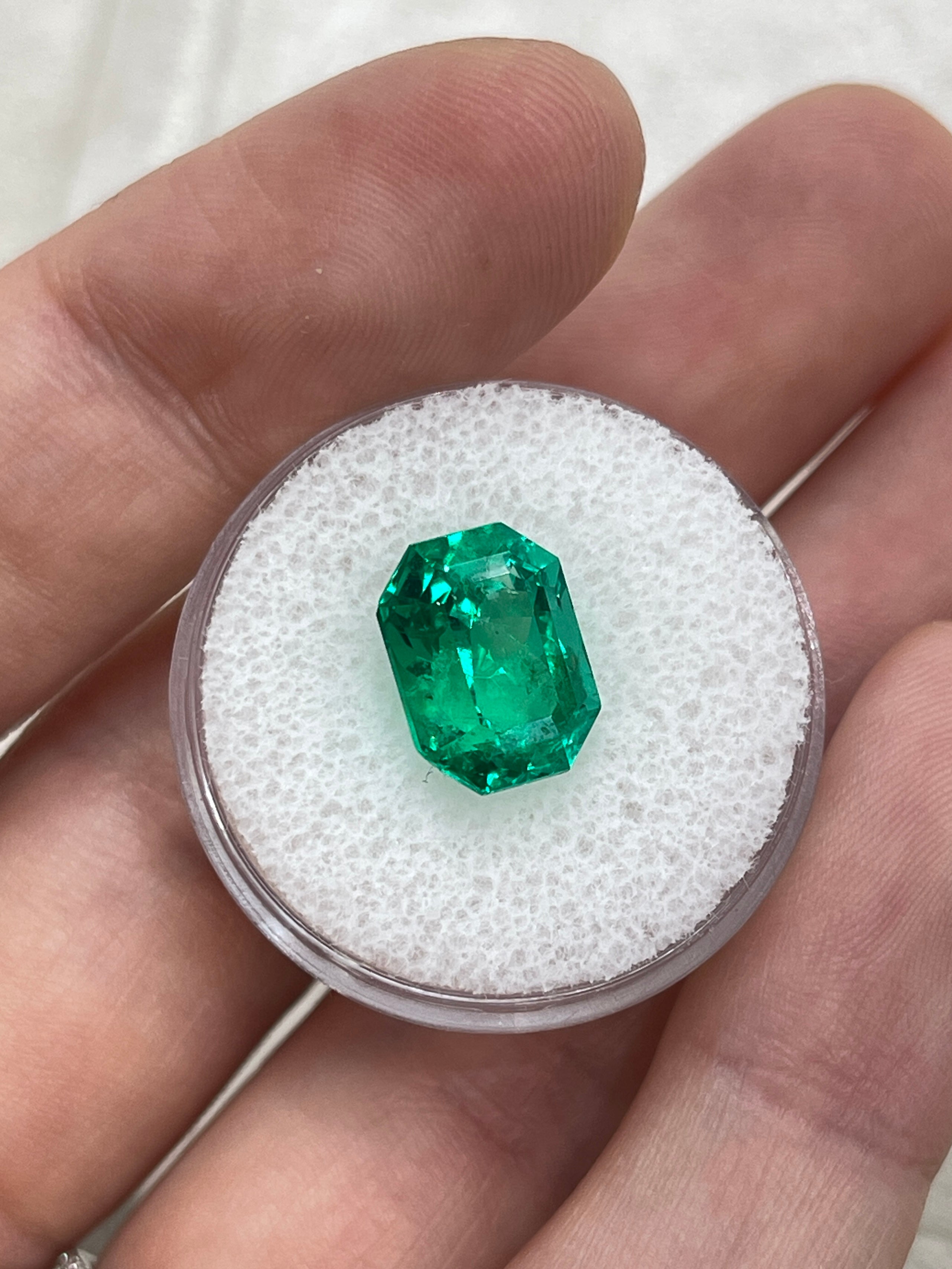 Vivid bluish green 5.21 carat Colombian emerald cut emerald with clipped corners, from JR Colombian Emeralds.