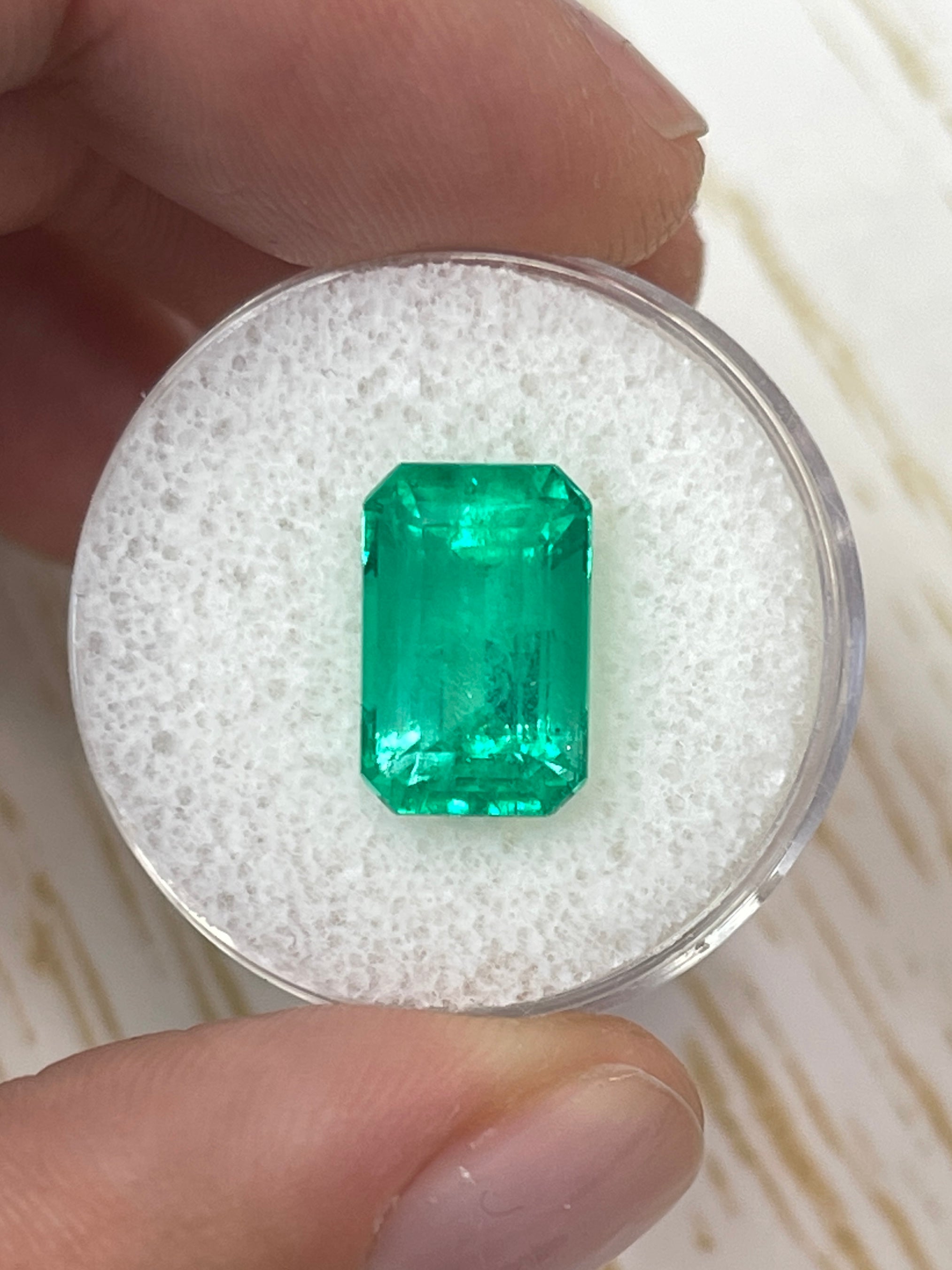 5.26 carat yellowish-green natural Colombian emerald in emerald cut, loose gemstone from JR Colombian Emeralds.