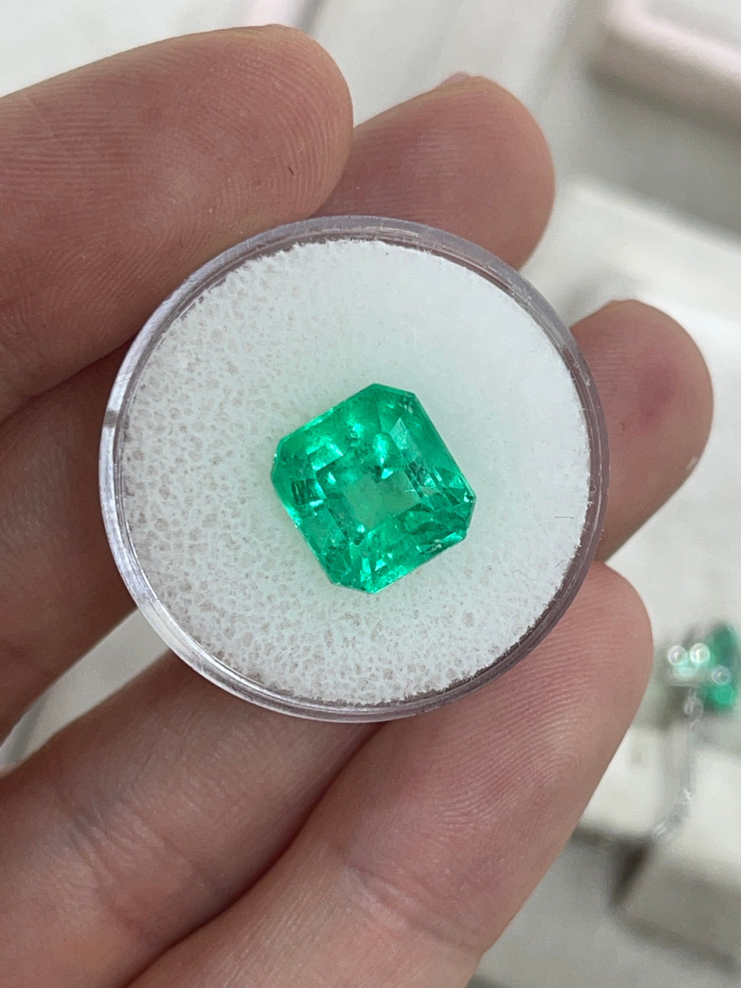 Vibrant 5.29 Carat Colombian Emerald in Asscher cut, featuring a 10.5x10mm loose gemstone by JR Colombian Emeralds.