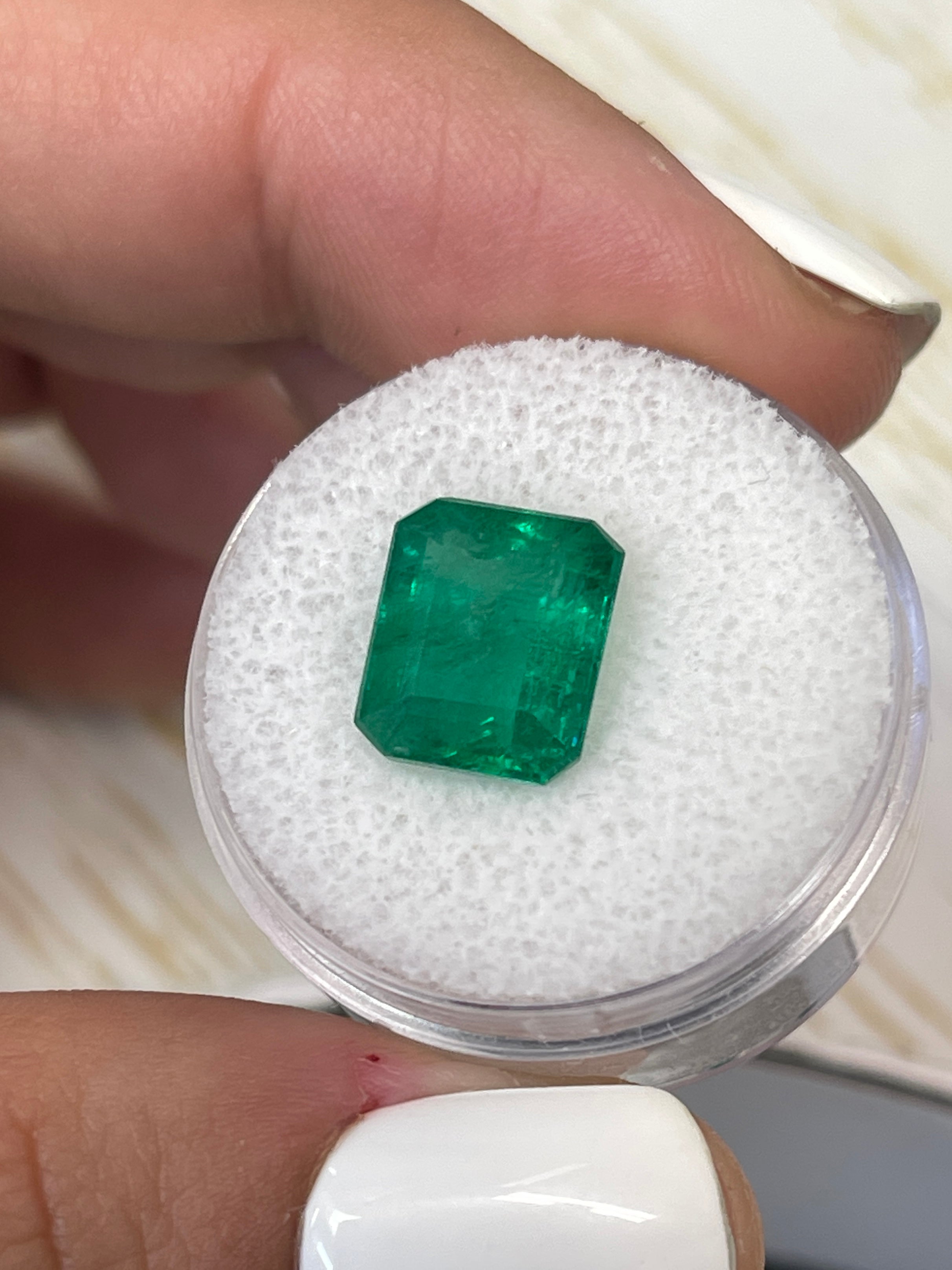 5.32 carat natural Zambian emerald cut loose gemstone in vivid Kelly green, supplied by JR Colombian Emeralds