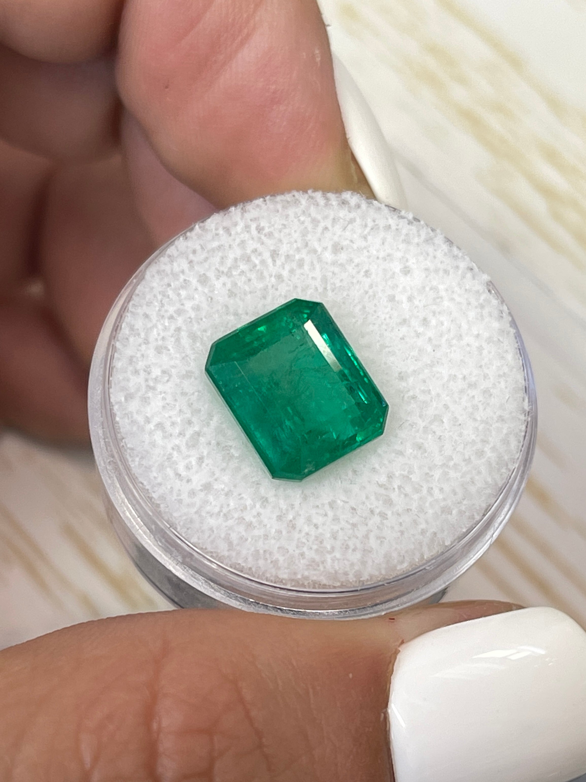 5.32-carat natural Zambian emerald cut loose gemstone in vivid Kelly green, from JR Colombian Emeralds.