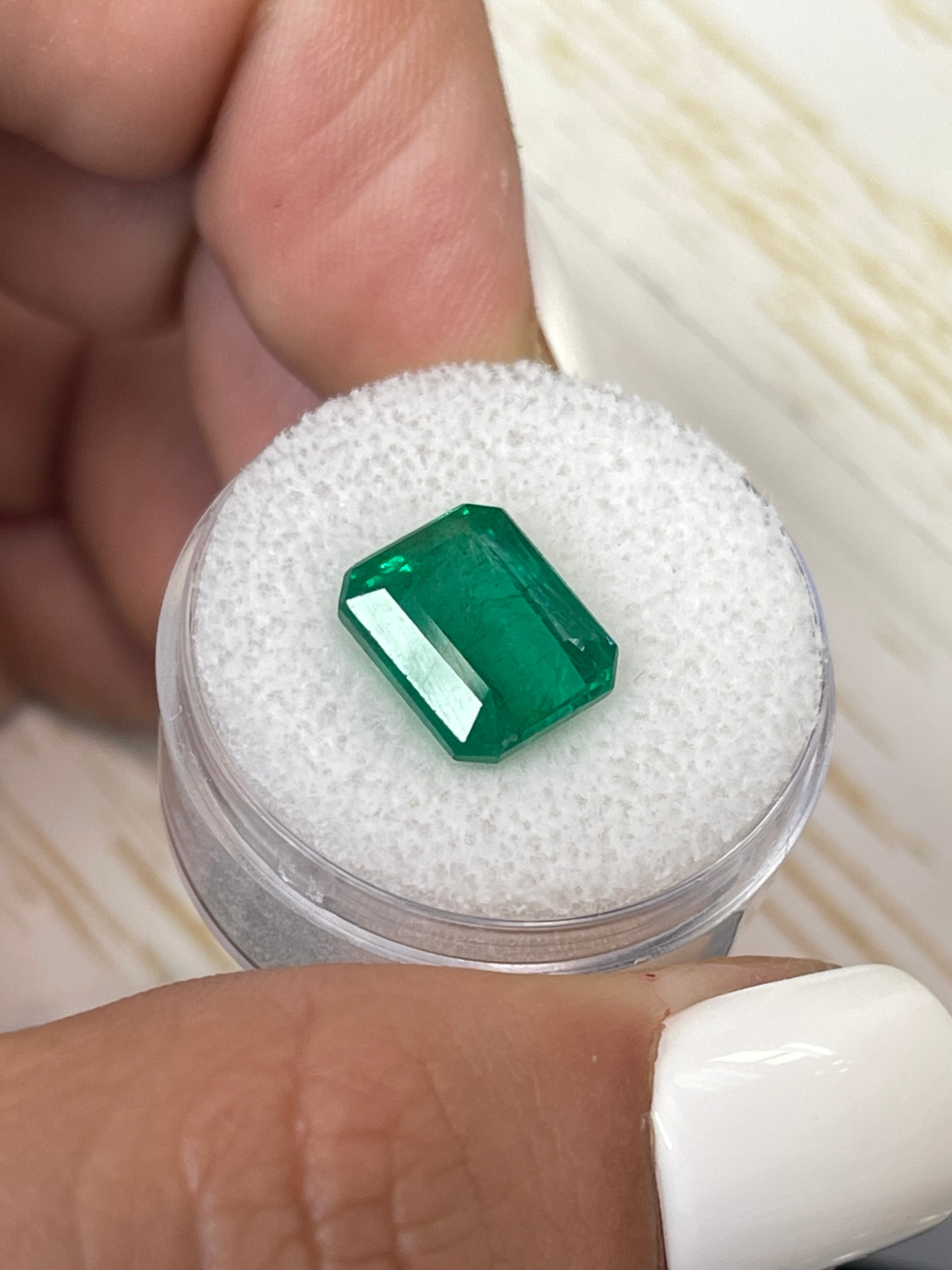 Natural 5.32 carat Zambian emerald cut loose emerald from JR Colombian Emeralds, vivid Kelly green, with clarity and brilliance.