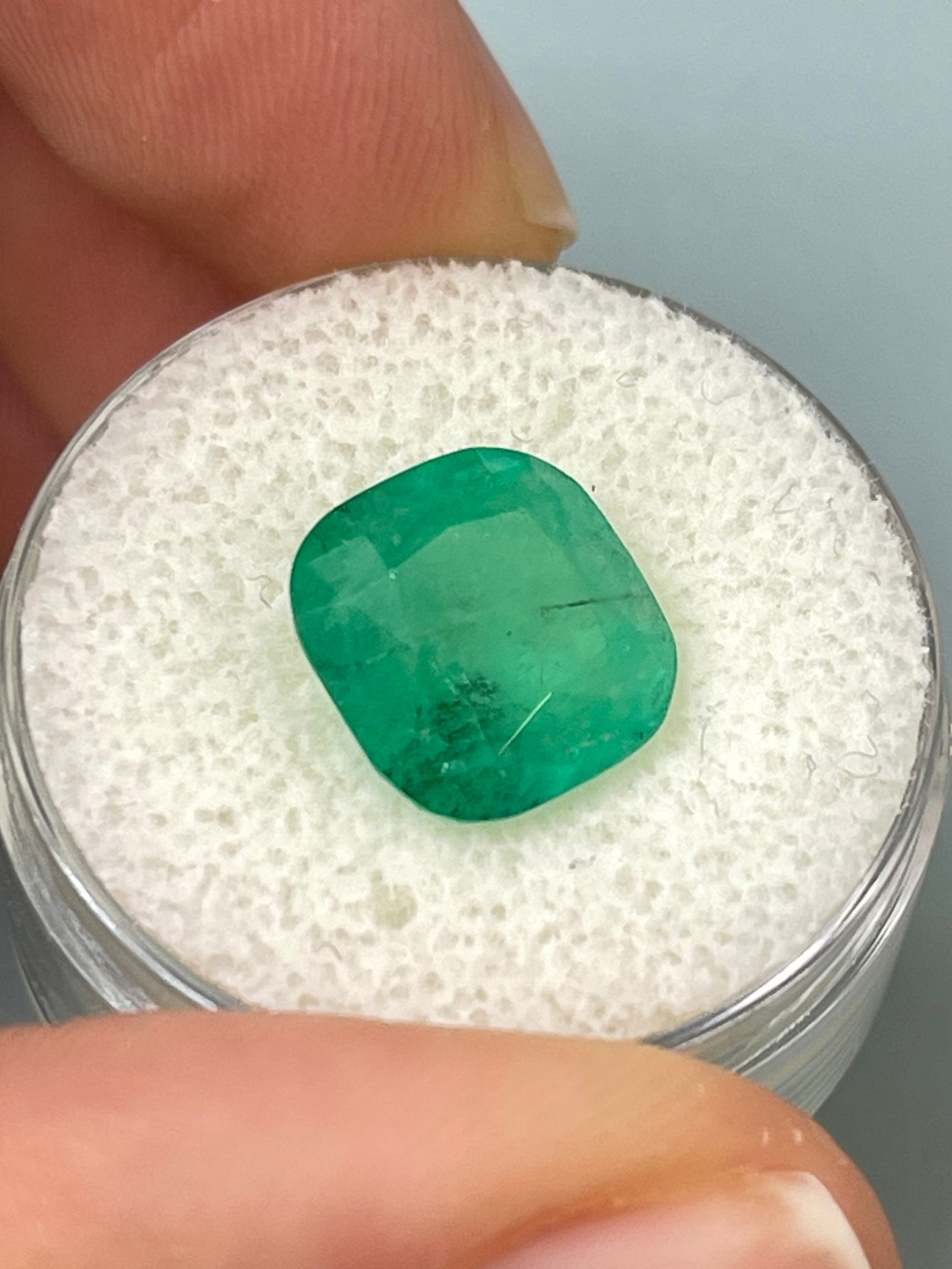 Natural 5.33 carat Colombian emerald loose cushion cut gemstone with earthy green tones, from JR Colombian Emeralds