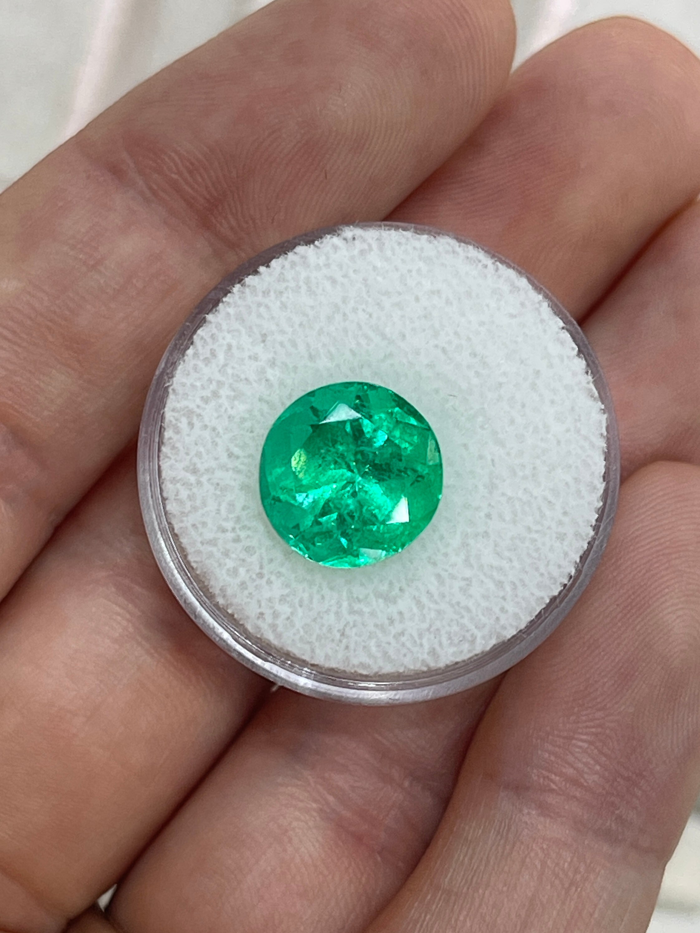 Vibrant green 5.48 carat round Colombian emerald gemstone with natural clarity, from JR Colombian Emeralds.