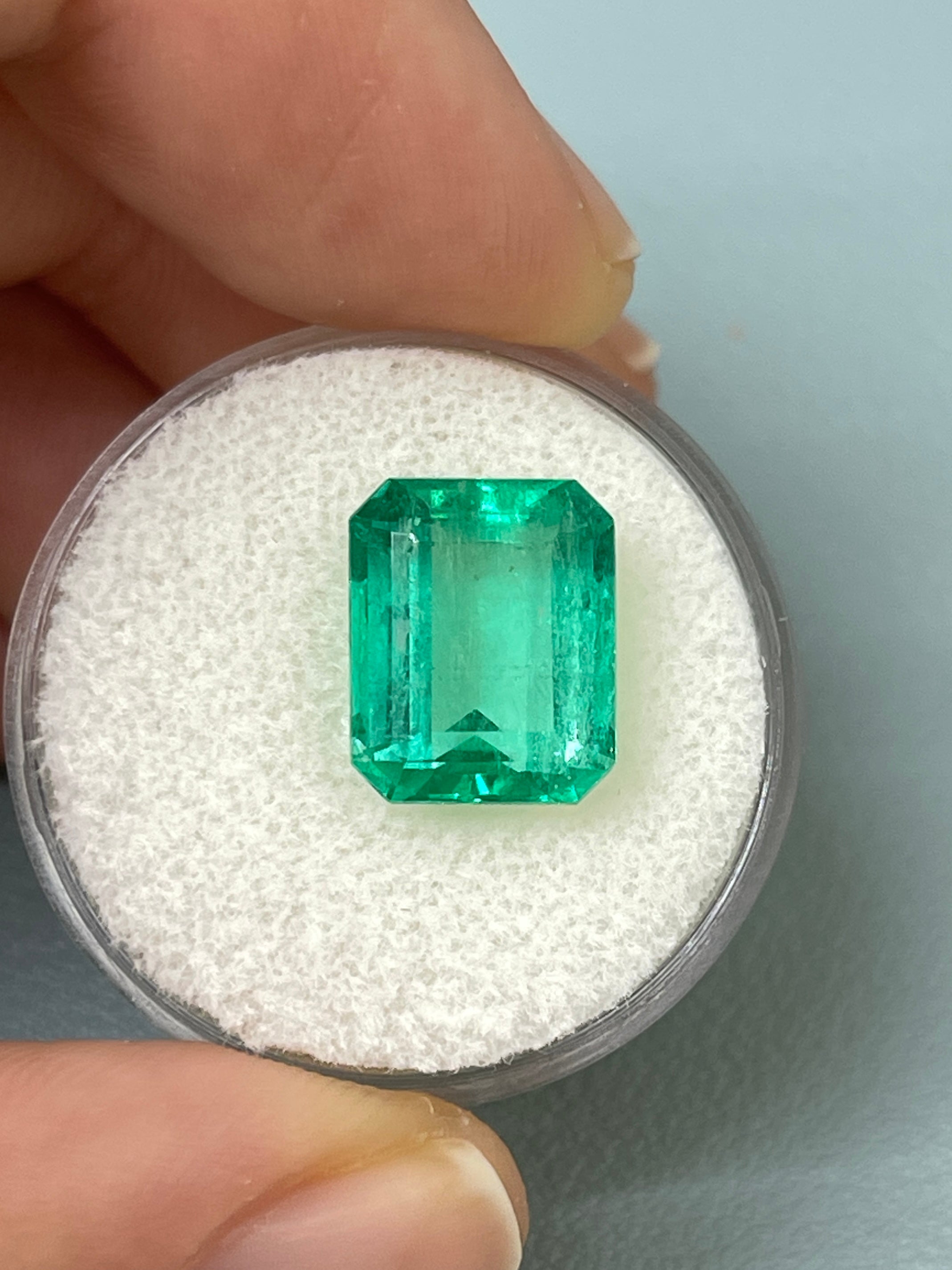 Medium green 5.50 carat natural Colombian emerald loose gemstone in classic emerald cut, showcased by JR Colombian Emeralds.