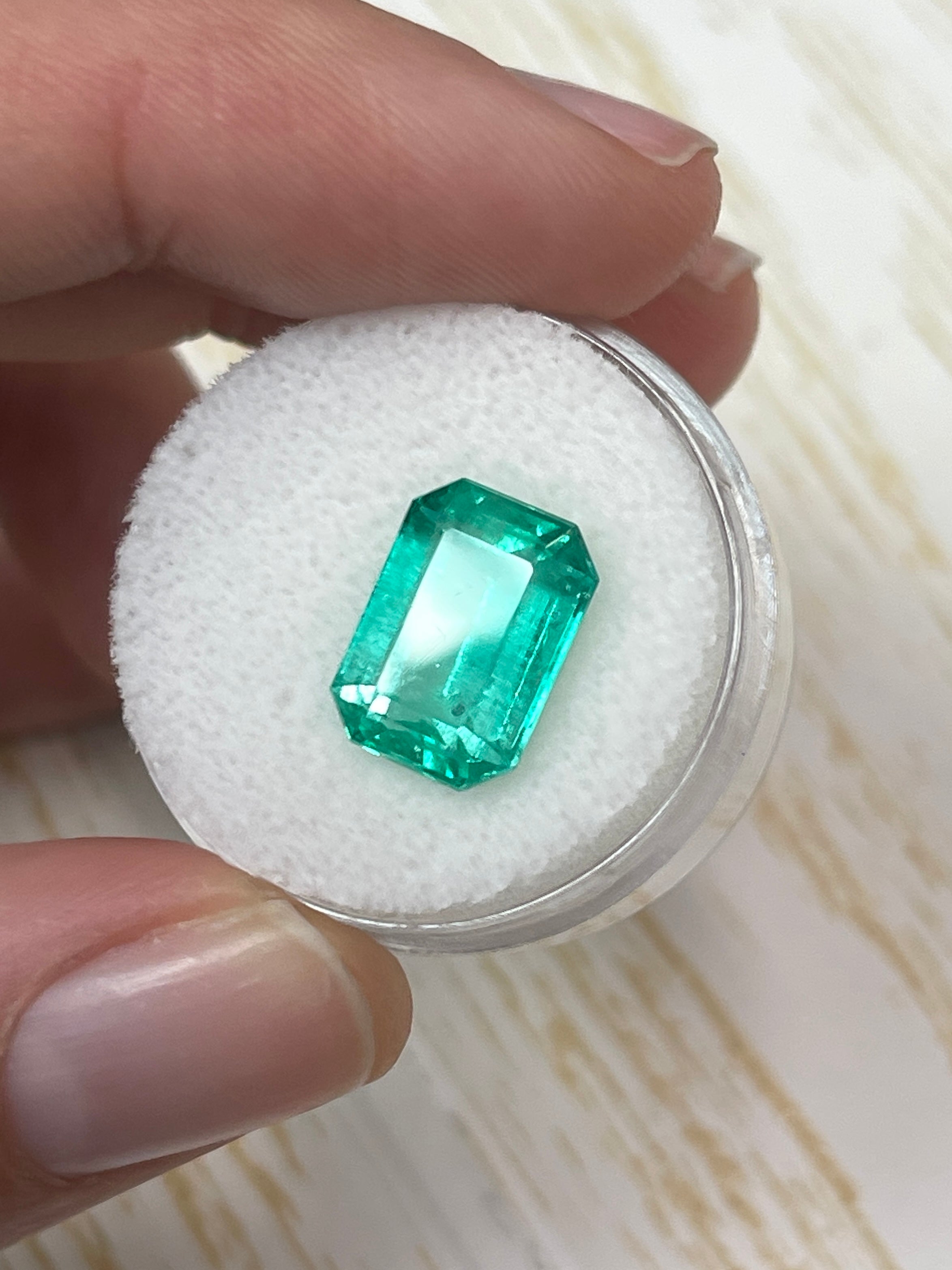 Natural 5.54 carat spring green Colombian emerald loose gemstone in elongated emerald cut, from JR Colombian Emeralds.