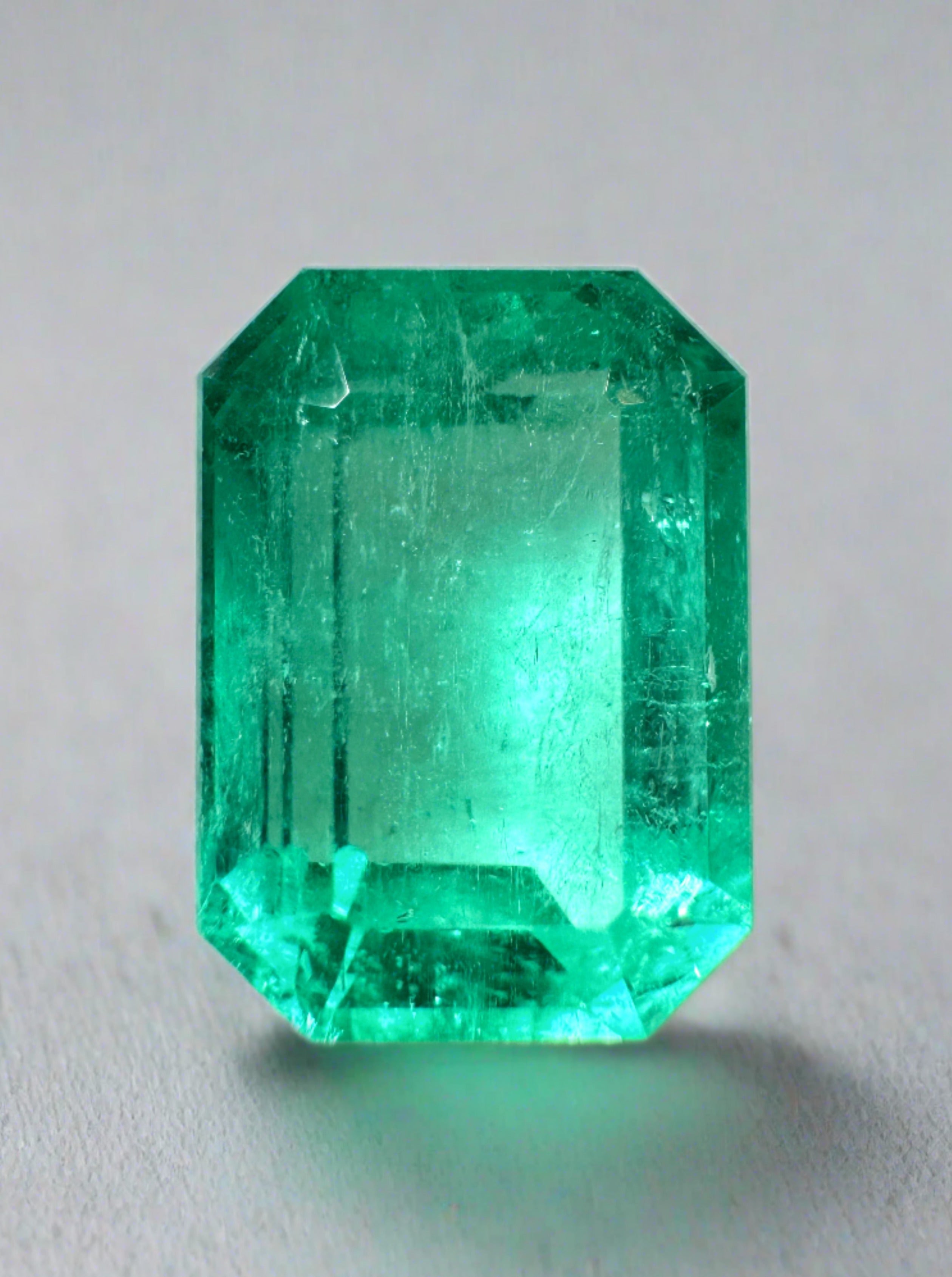 Loose 5.54 carat spring green Colombian emerald in elongated emerald cut, natural and unmounted, from JR Colombian Emeralds.