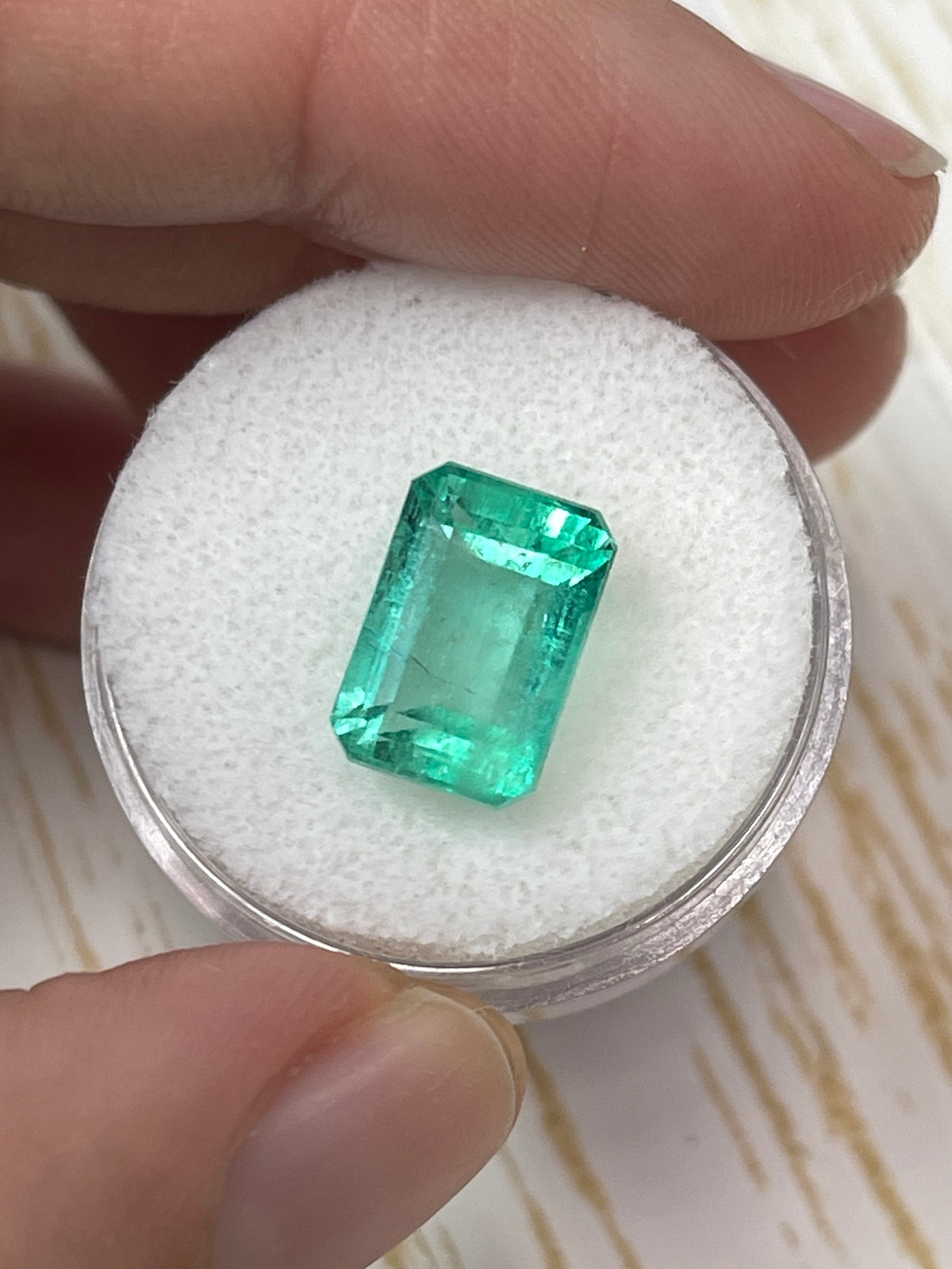 Natural 5.55 Carat 12x8 Pastel Green Colombian Emerald in emerald cut, loose gemstone from JR Colombian Emeralds.