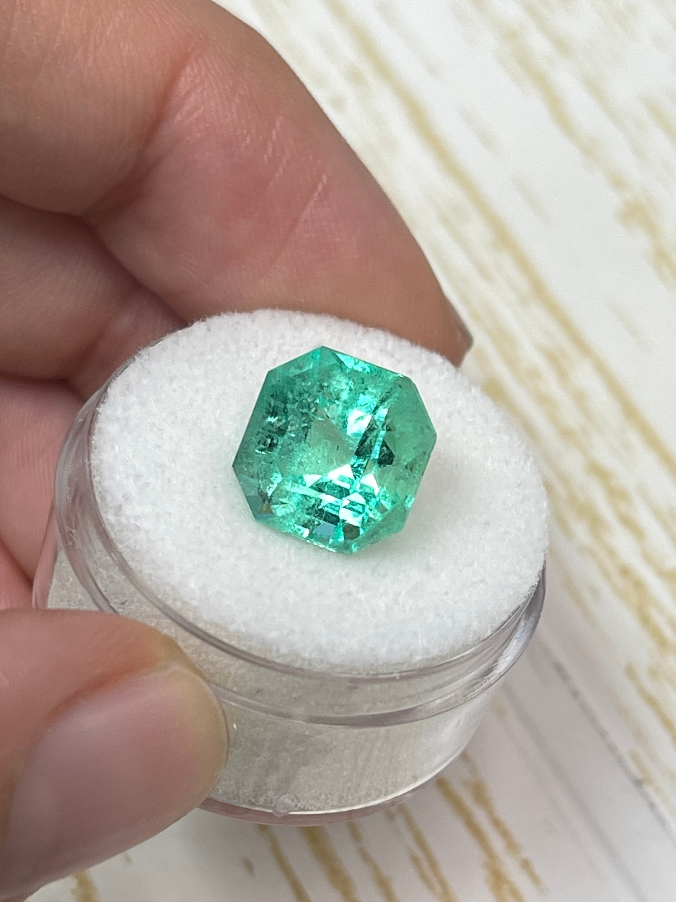5.56 carat natural Colombian emerald loose gemstone with an Asscher cut, vibrant spring green color, from JR Colombian Emeralds