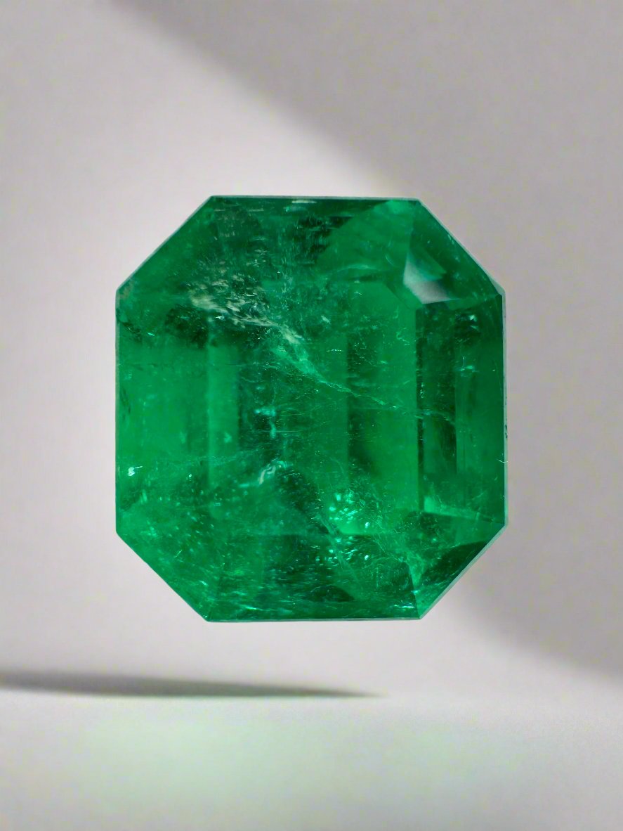 5.56 carat AAA Vivid Muzo Colombian Emerald loose gemstone with emerald cut, showcasing deep green color and clarity.