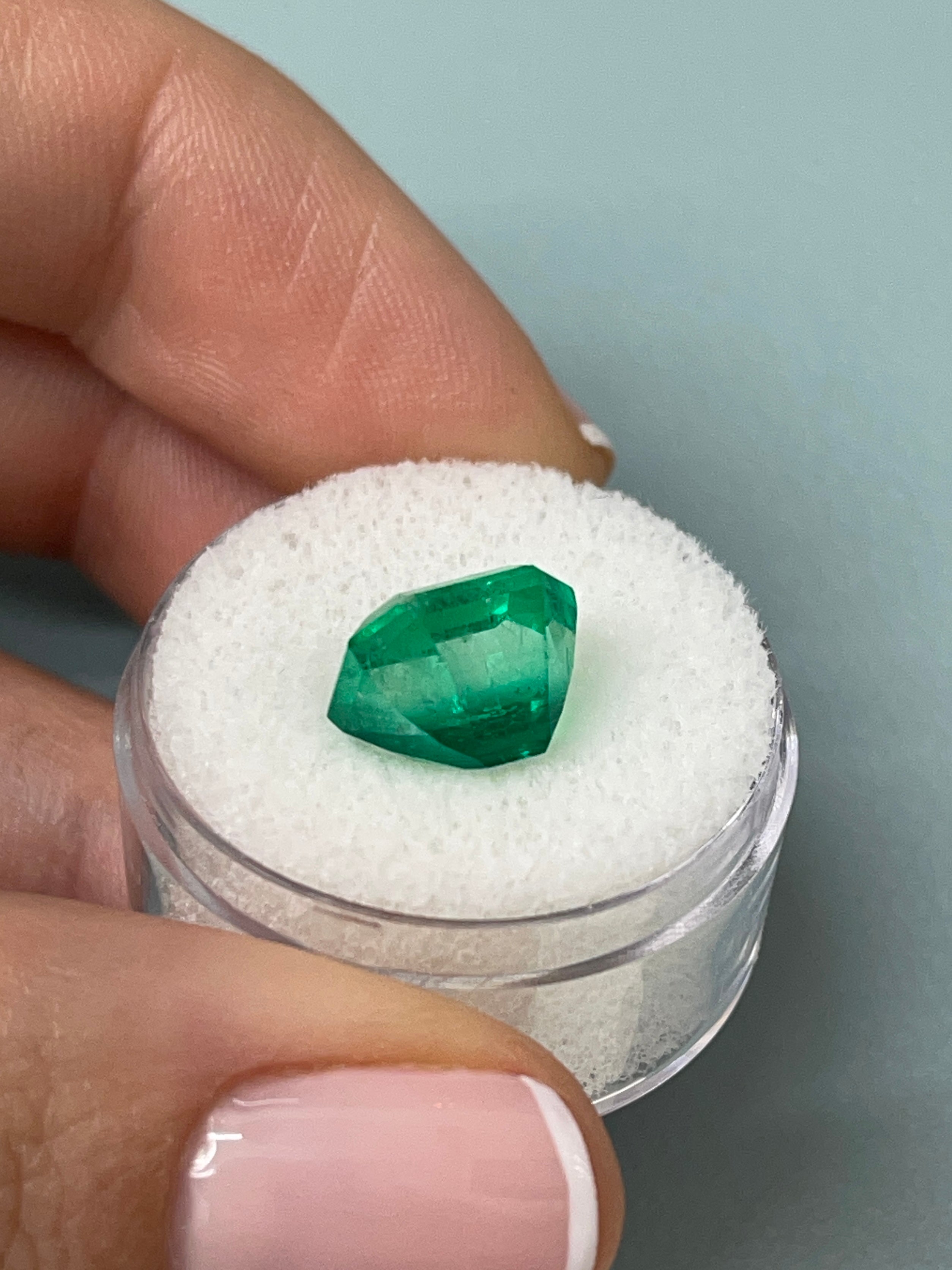 5.56 carat AAA Vivid Muzo Colombian emerald loose gemstone with emerald cut, showcasing rich green color and clarity.