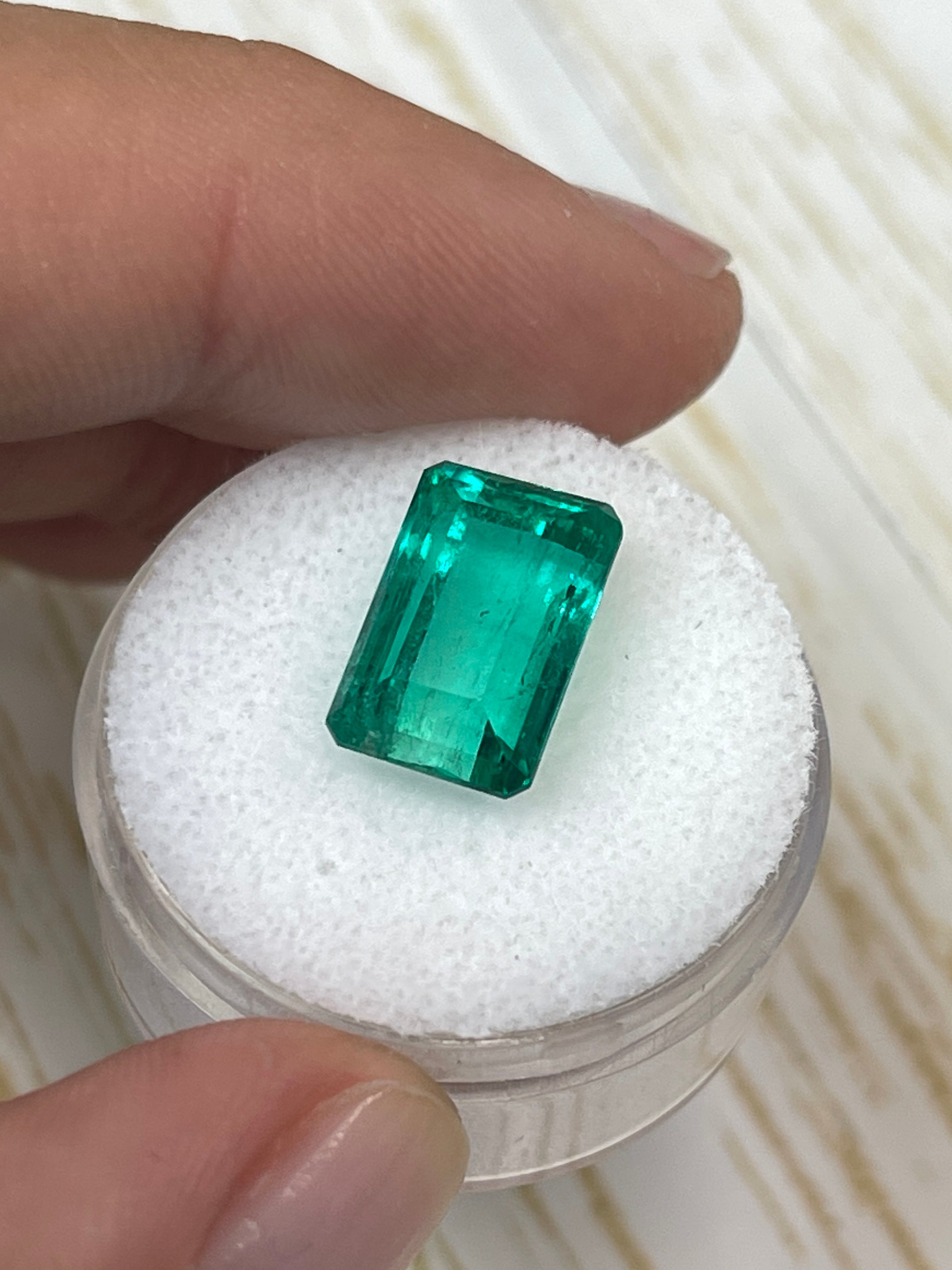5.63 carat 13x8 mm VS bluish green natural Colombian emerald loose gemstone in an emerald cut, from JR Colombian Emeralds.