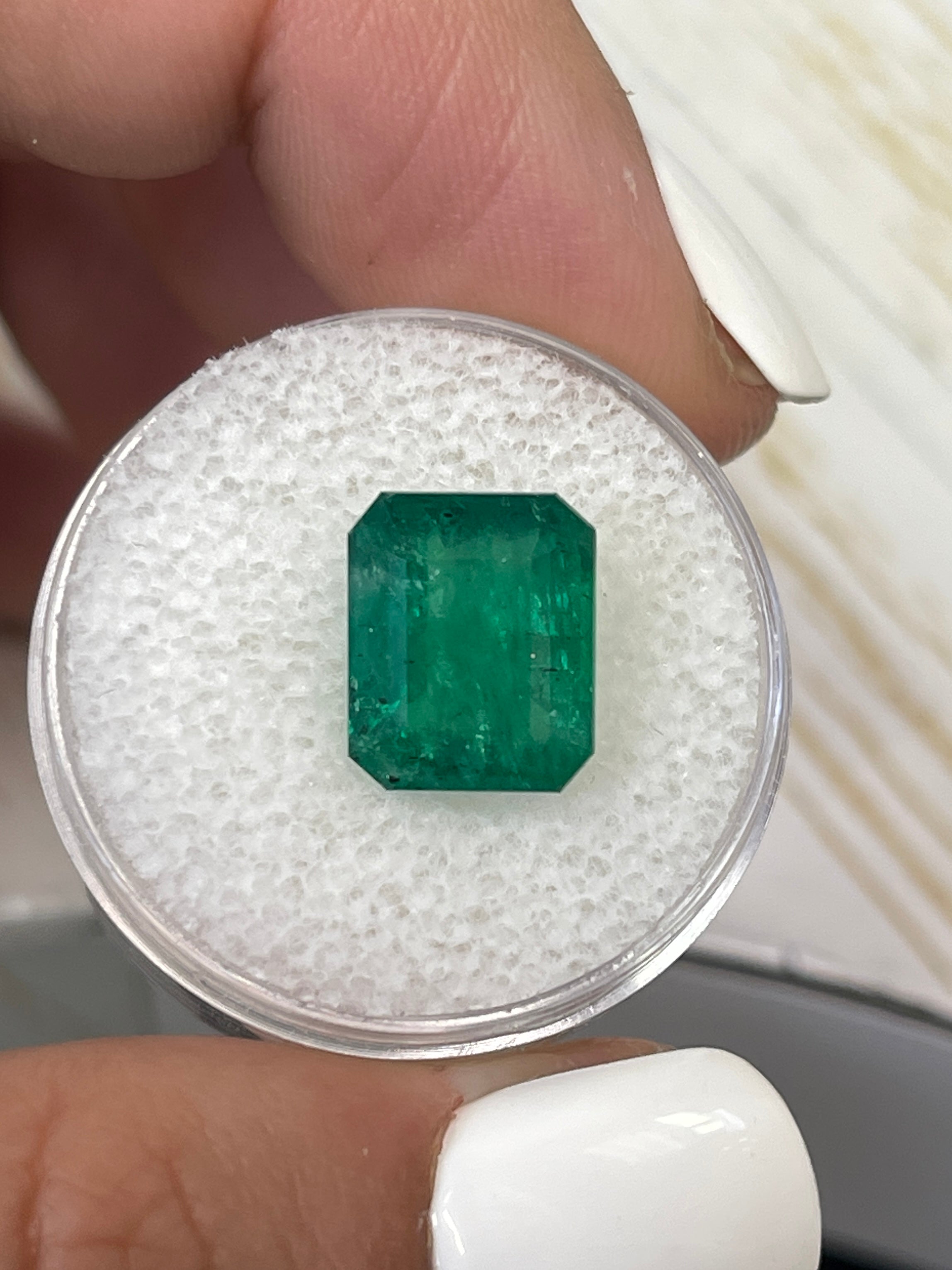 Natural 5.68 Carat Zambian emerald cut gemstone, medium deep green, loose and unmounted by JR Colombian Emeralds.