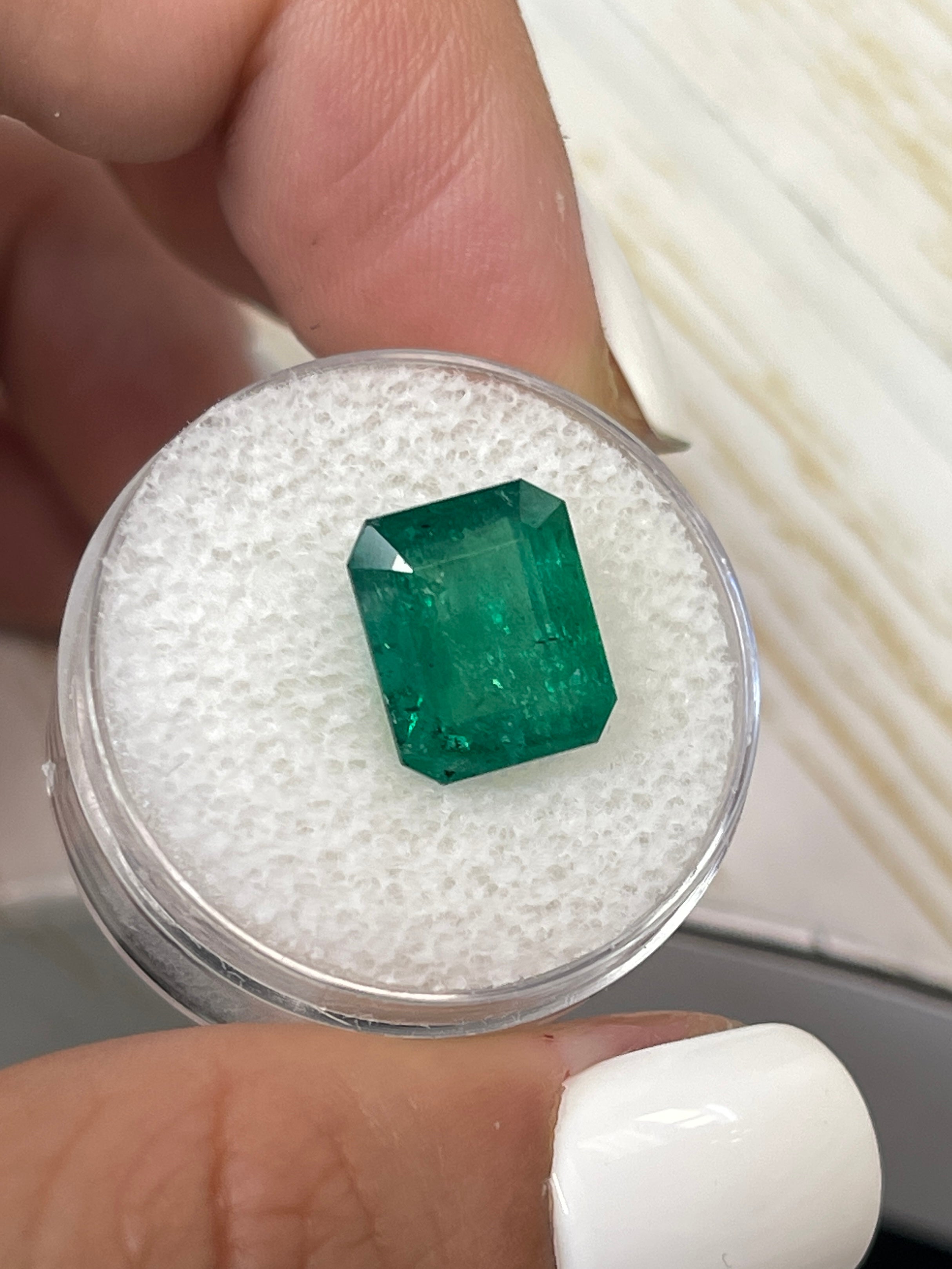 5.68 carat medium deep green natural Zambian emerald cut loose gemstone from JR Colombian Emeralds.