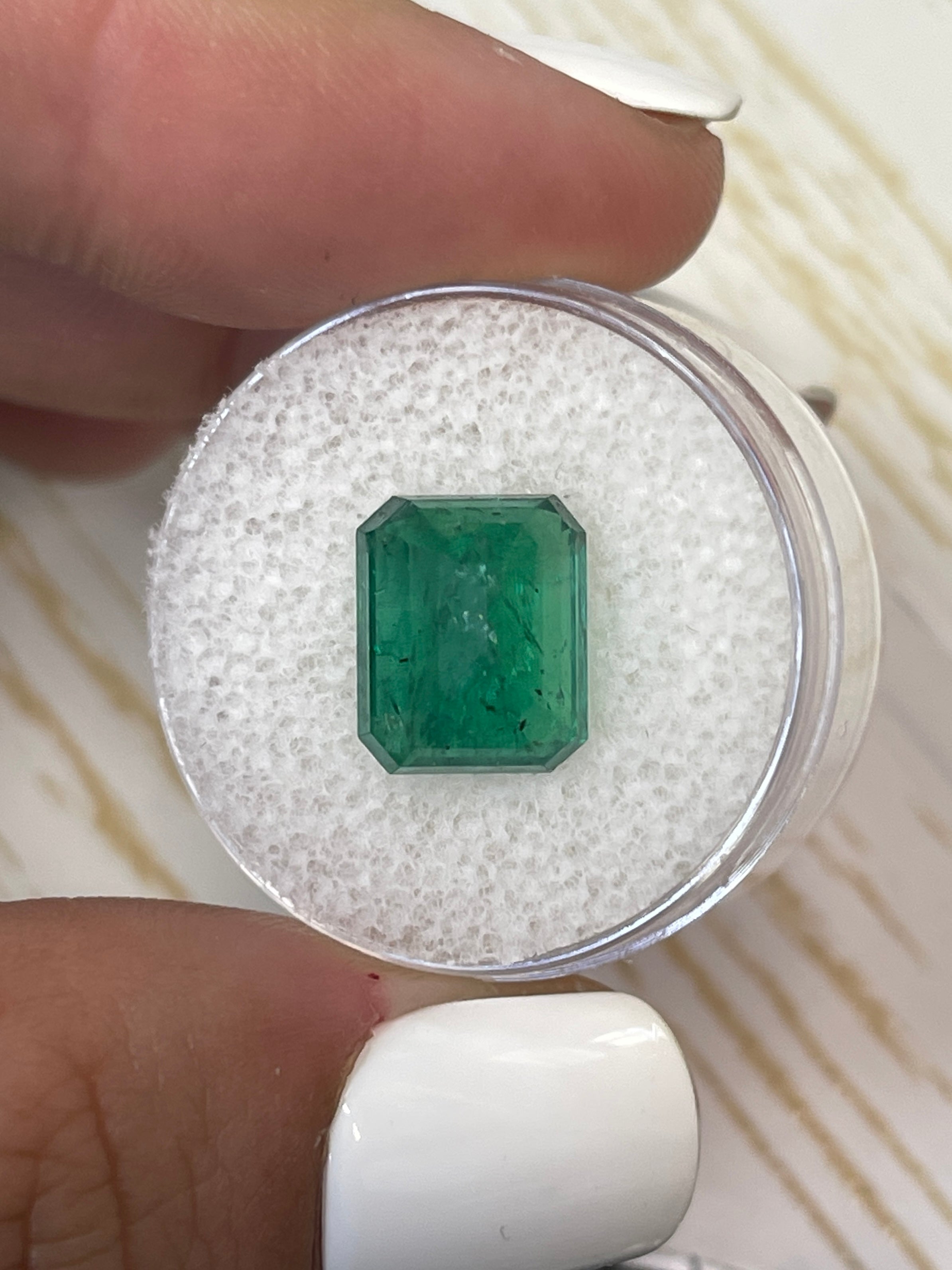 Medium deep green 5.68 carat natural Zambian emerald cut loose emerald gemstone by JR Colombian Emeralds.