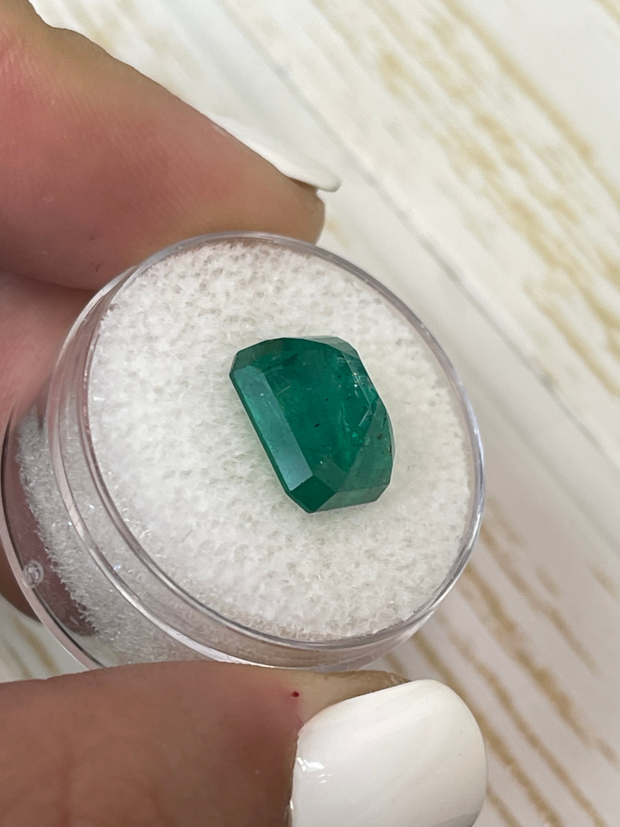 Natural 5.68 Carat Zambian emerald cut loose emerald with medium deep green color from JR Colombian Emeralds.