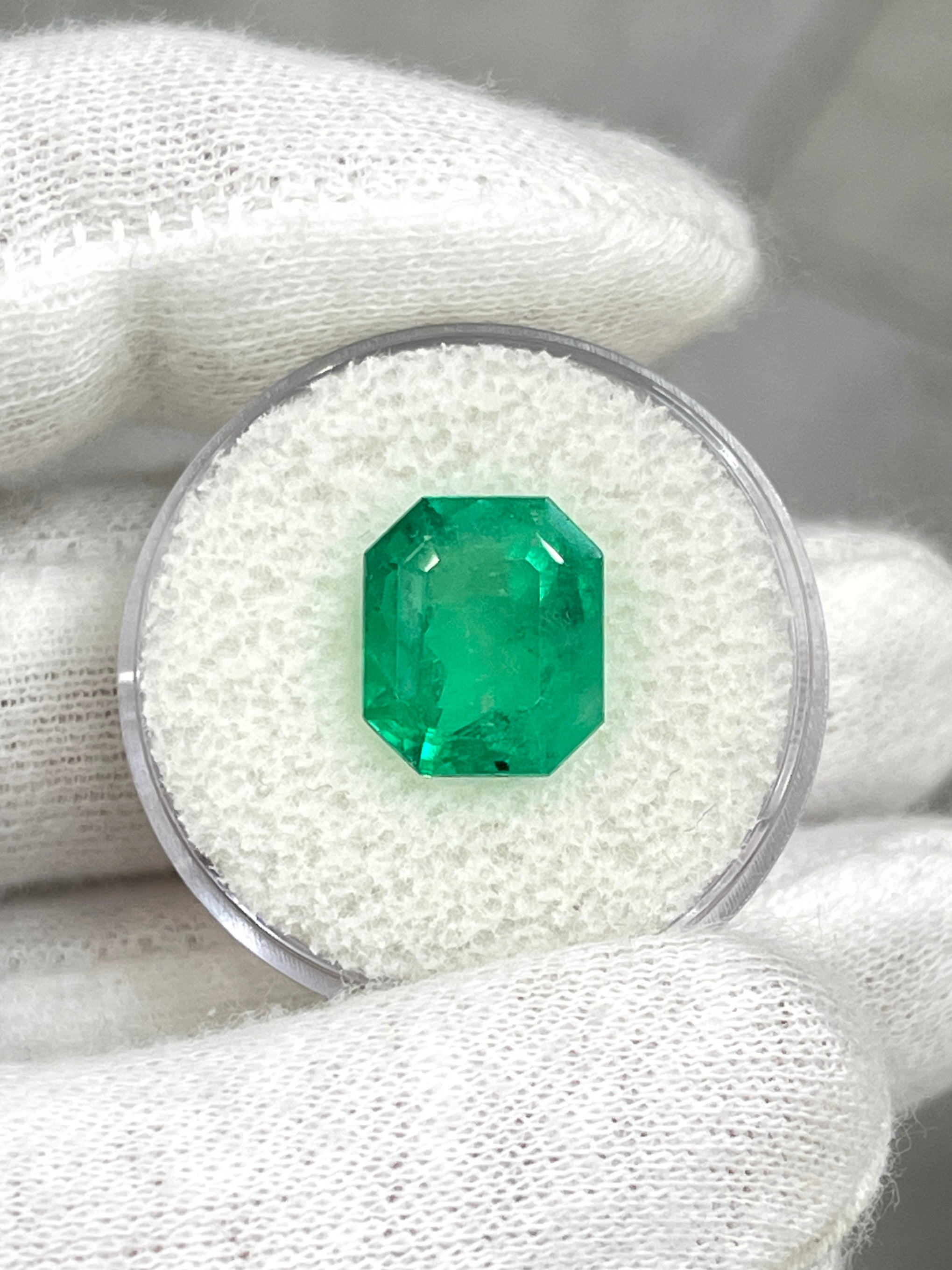 Freckled 5.75 carat medium green Colombian emerald loose gemstone in emerald cut, from JR Colombian Emeralds.