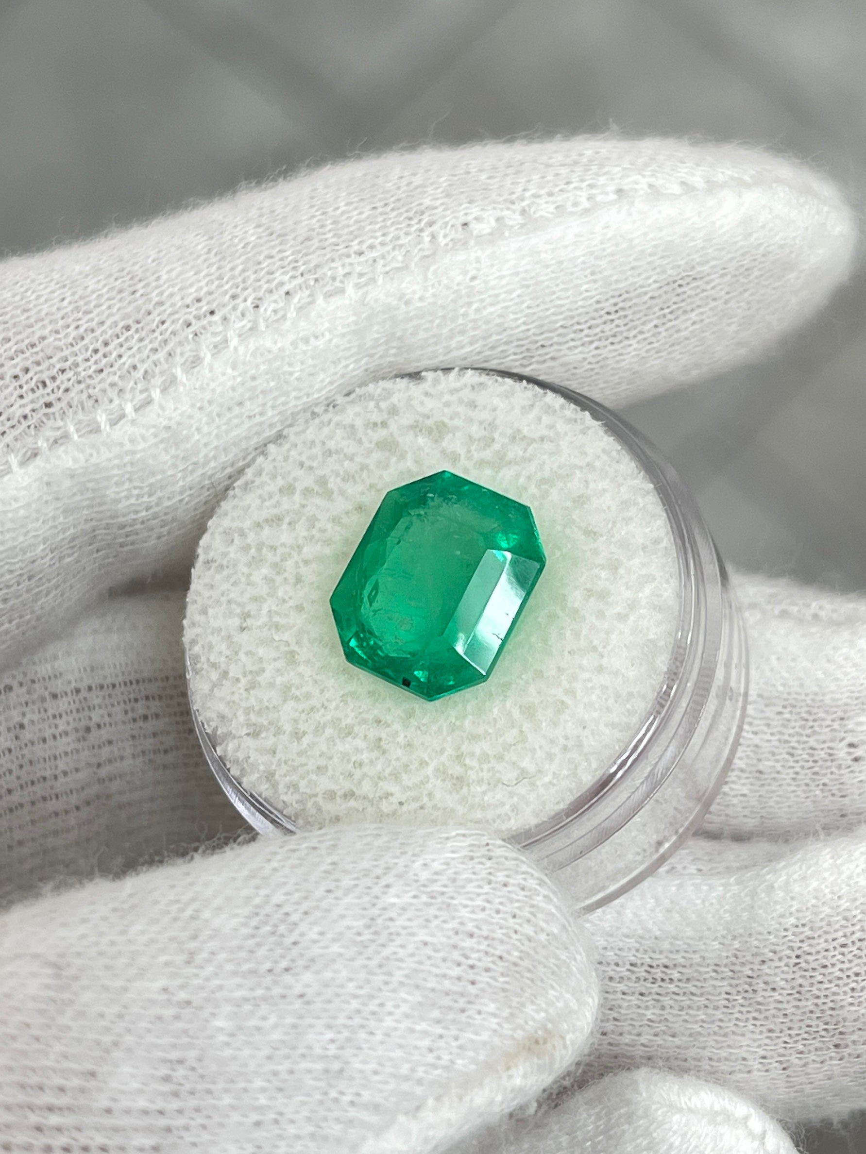 Natural loose Colombian emerald, 5.75 carats, emerald cut, medium green with natural freckling, from JR Colombian Emeralds.