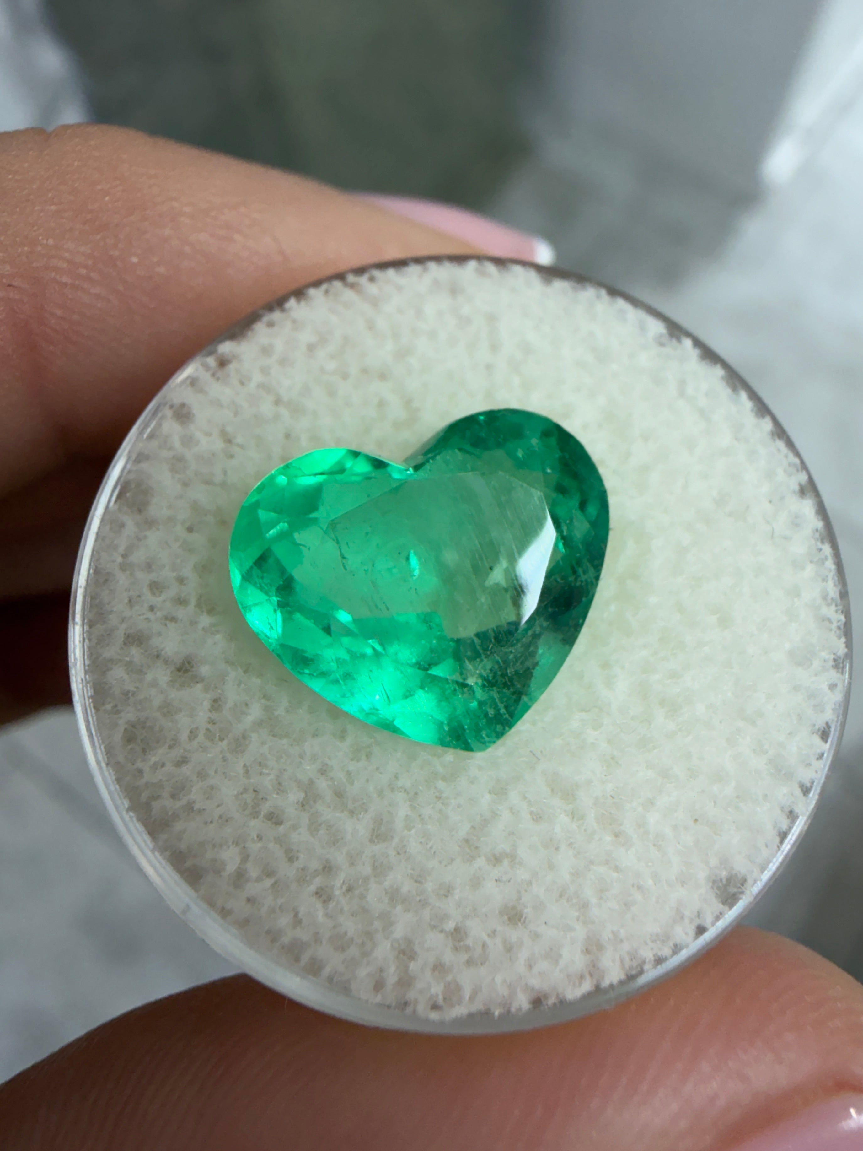 Natural 5.87 carat Colombian emerald in heart cut, vibrant green, loose gemstone from JR Colombian Emeralds.