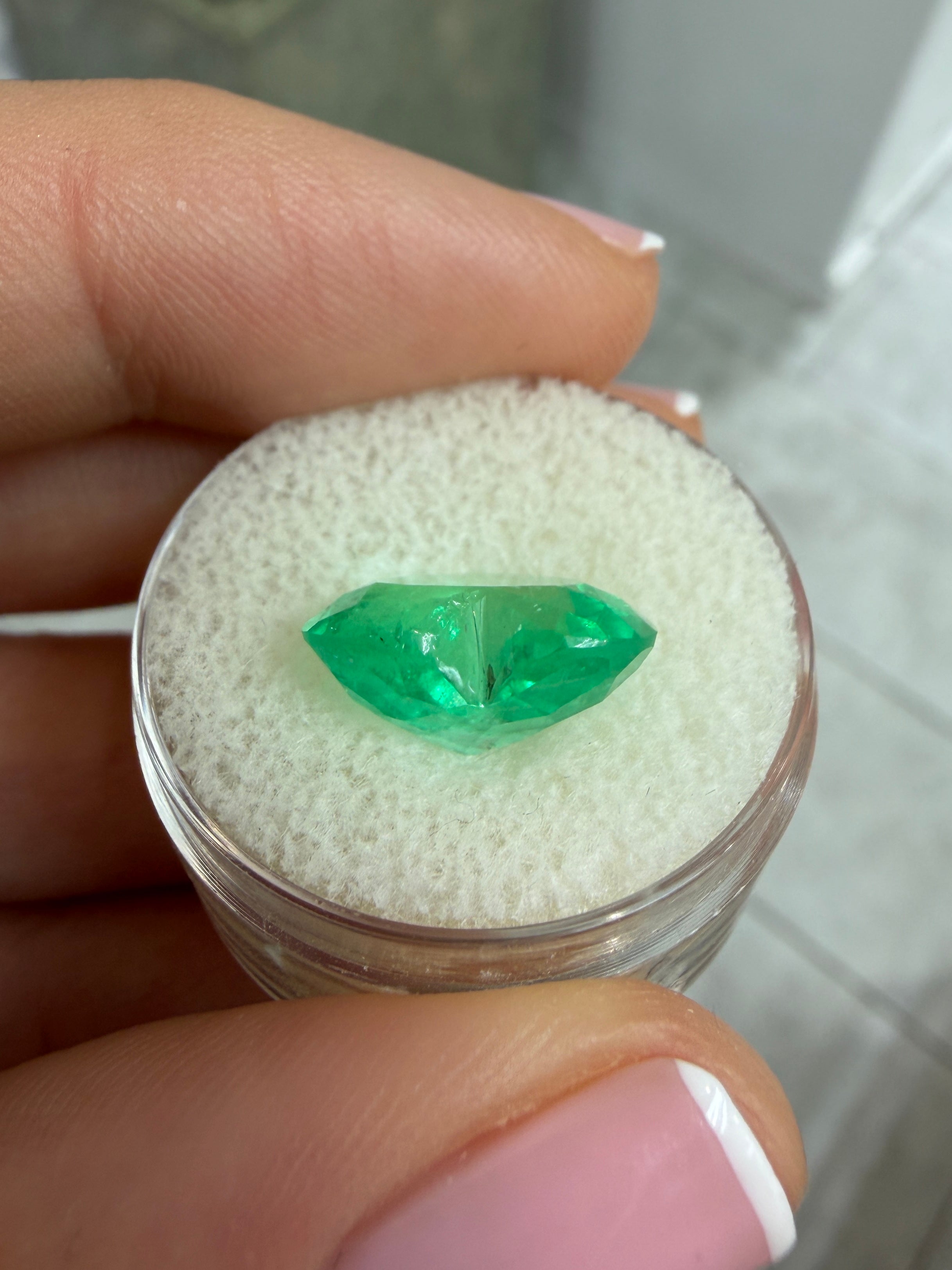 5.87 carat natural Colombian emerald in heart cut with vibrant green color, loose gemstone from JR Colombian Emeralds.
