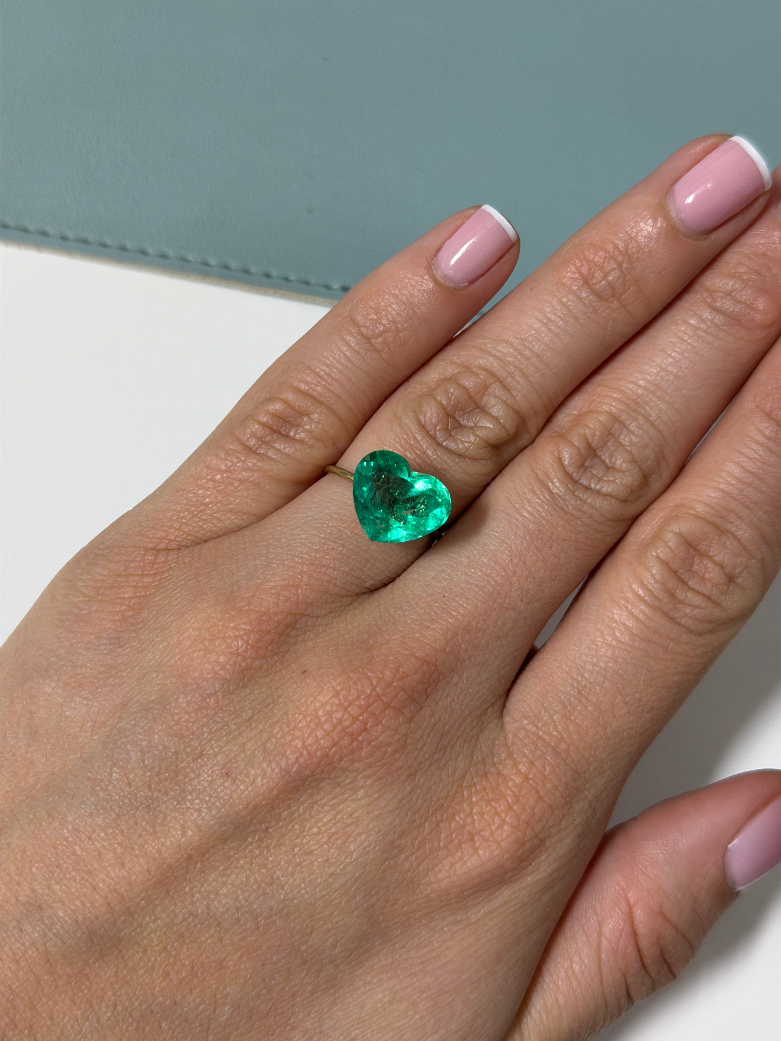 Natural 5.87 carat Colombian emerald loose gemstone, heart cut, vibrant green color, from JR Colombian Emeralds.