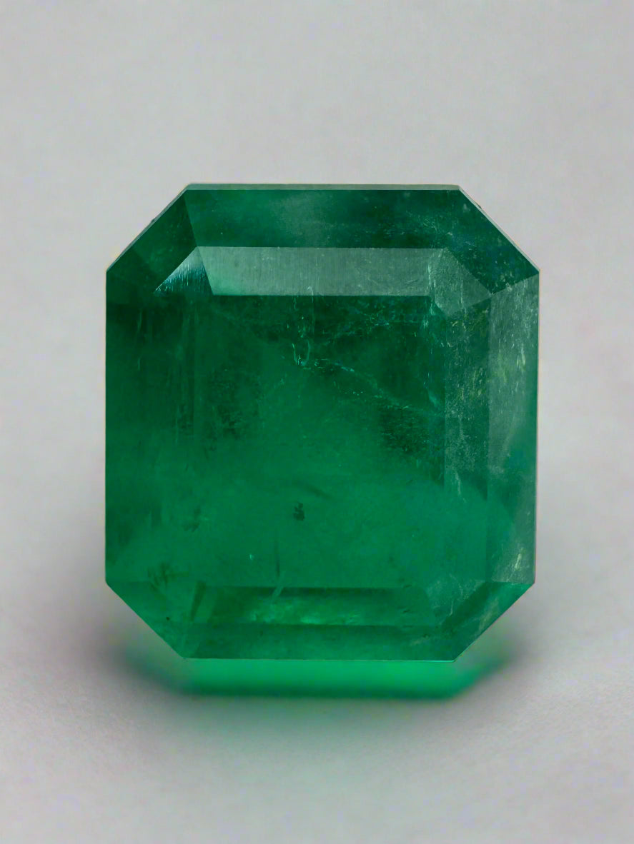 Deep green 5.94 carat Colombian emerald loose gemstone in an emerald cut, showcasing natural clarity and rich color.