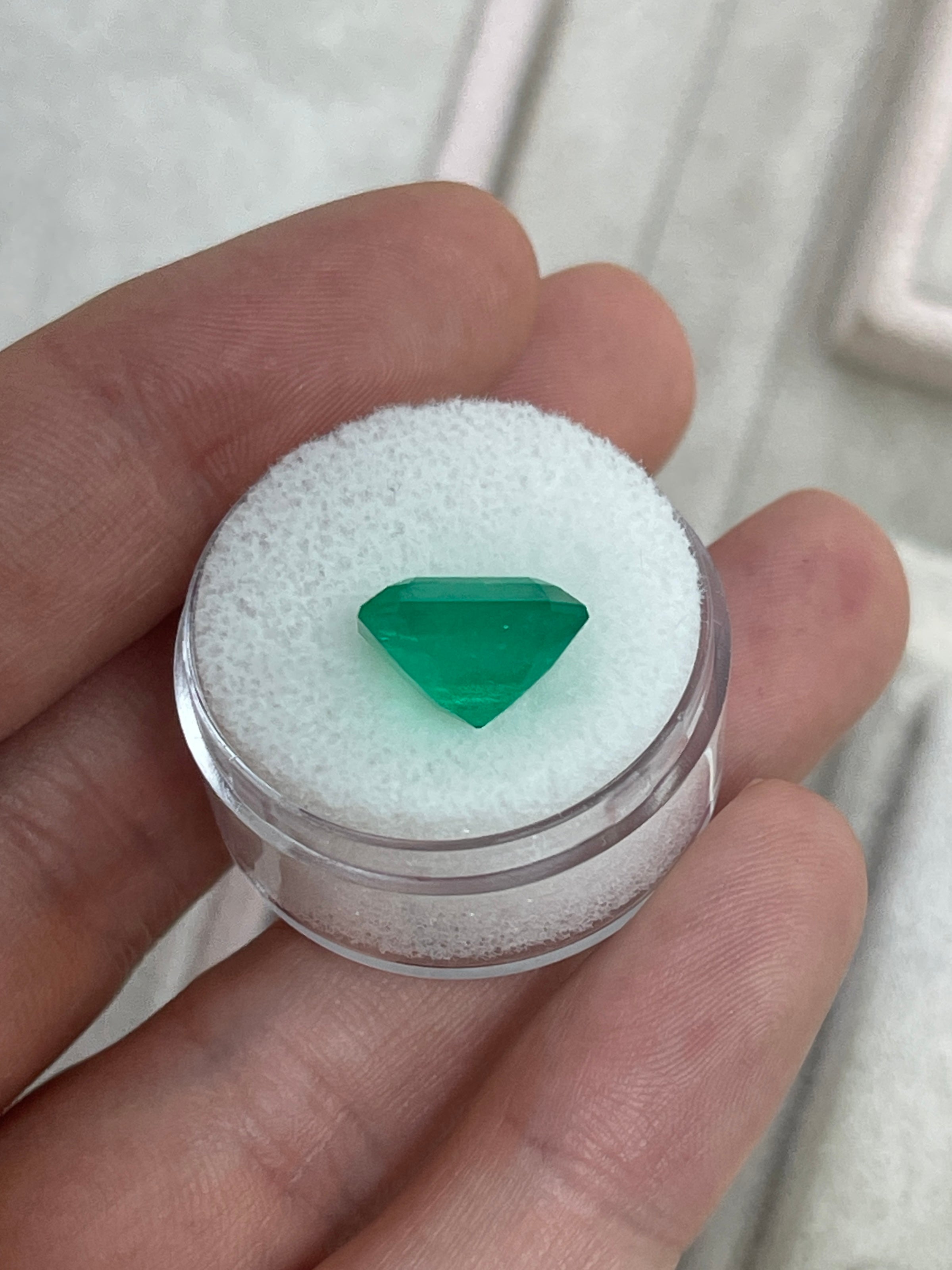 Deep green 5.94 carat Colombian emerald loose gemstone in emerald cut, natural and high-quality from JR Colombian Emeralds.
