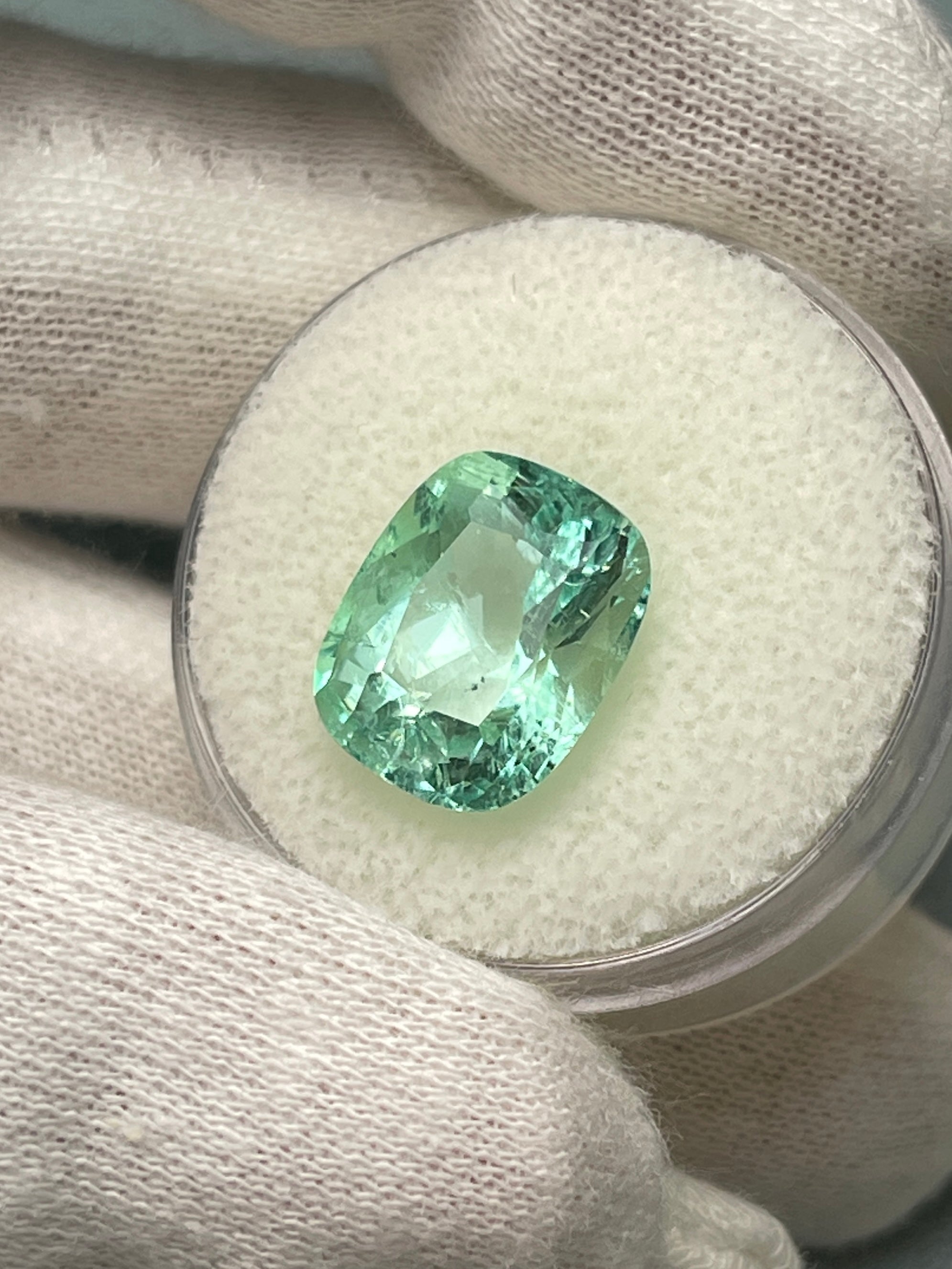 Seafoam green 5.96 carat Colombian emerald loose gemstone, elongated cushion cut with natural freckles, from JR Colombian Emeralds.