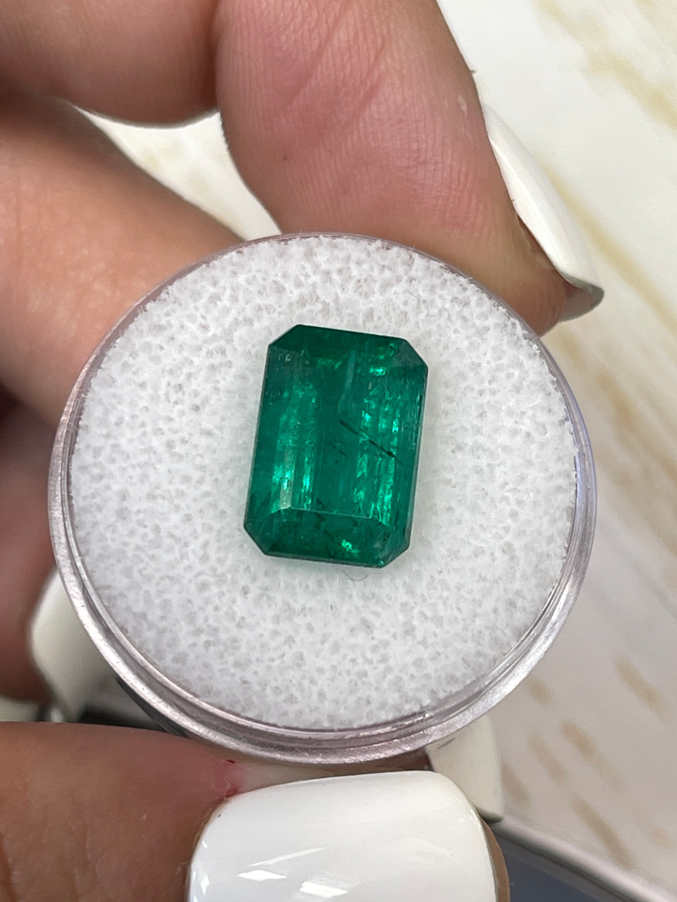 Vivid green 5.97 carat natural Zambian emerald cut loose gemstone from JR Colombian Emeralds, 13x9mm.