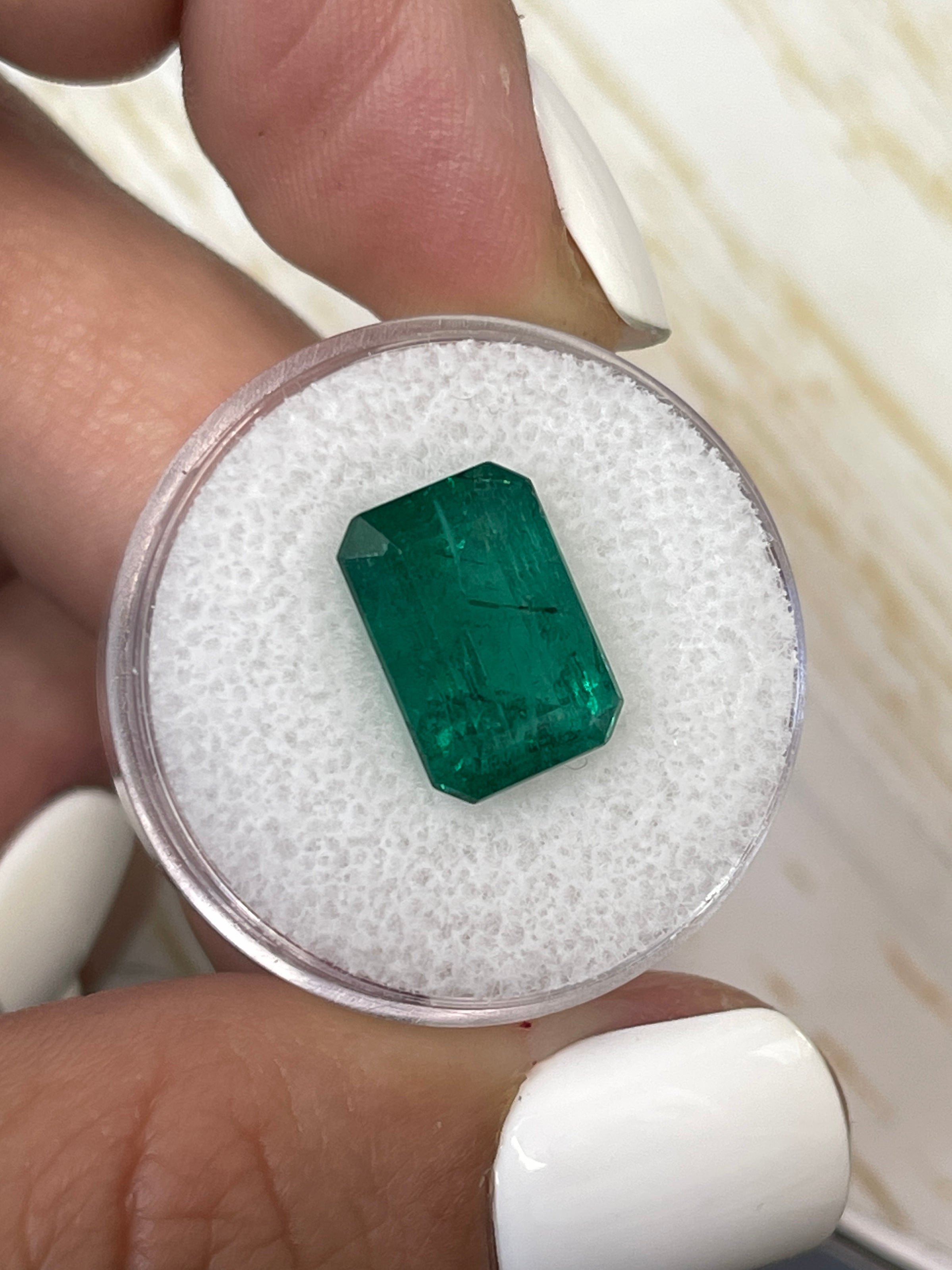 Vivid green 5.97 carat natural Zambian emerald cut loose emerald gemstone by JR Colombian Emeralds.