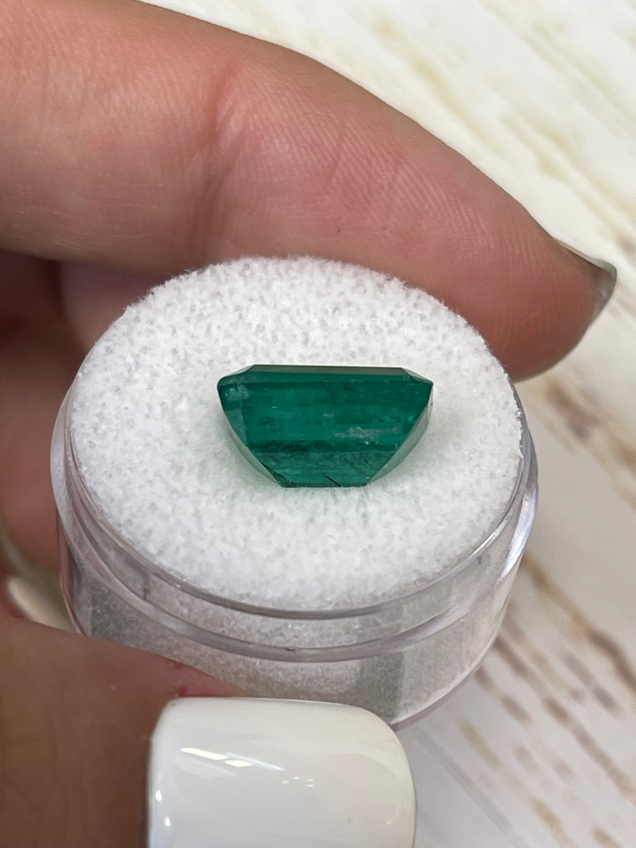 Vivid green 5.97 carat natural Zambian emerald cut loose gemstone from JR Colombian Emeralds.