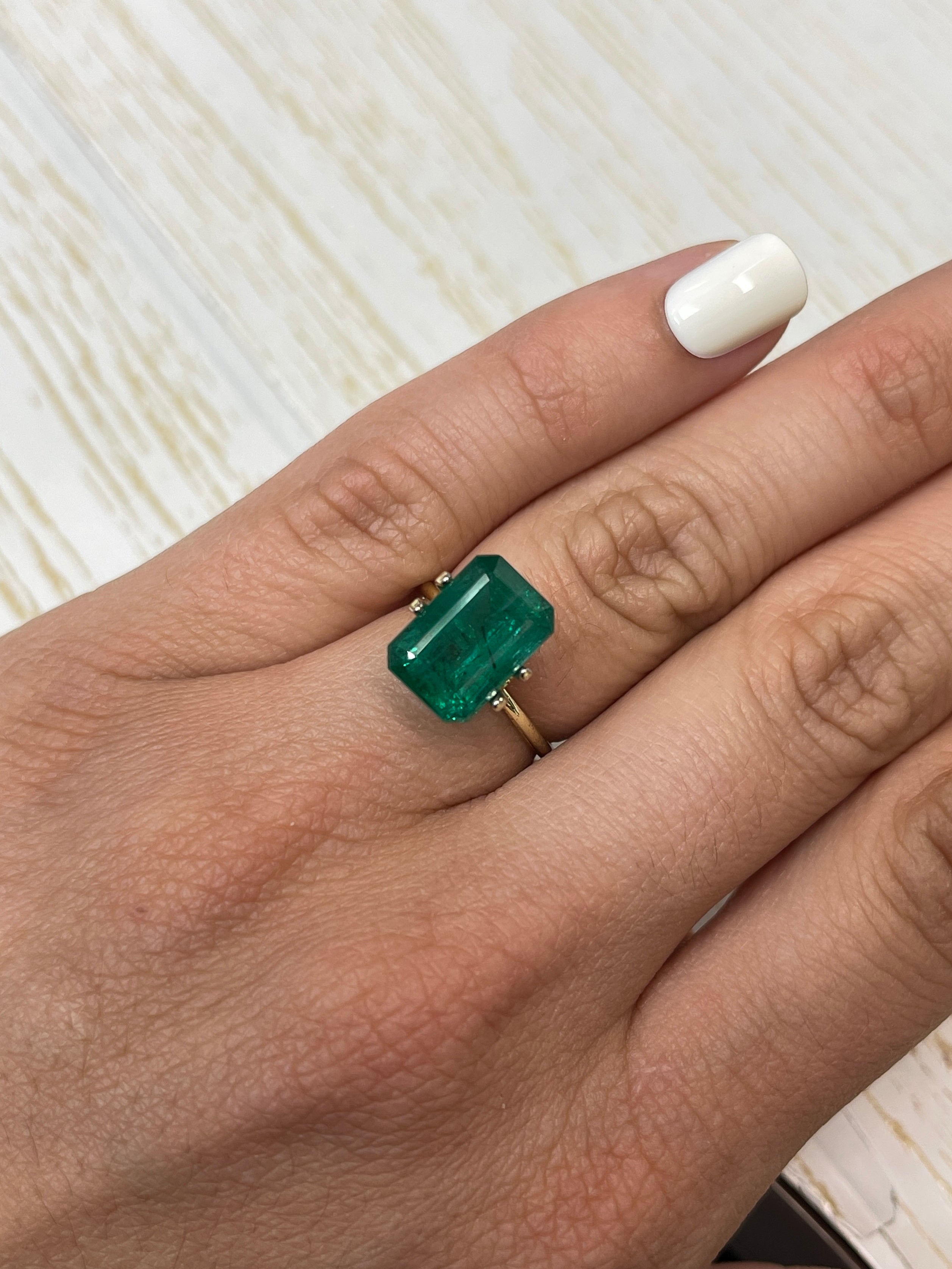 Vivid green 5.97 carat natural Zambian emerald cut loose gemstone, 13x9 mm from JR Colombian Emeralds.