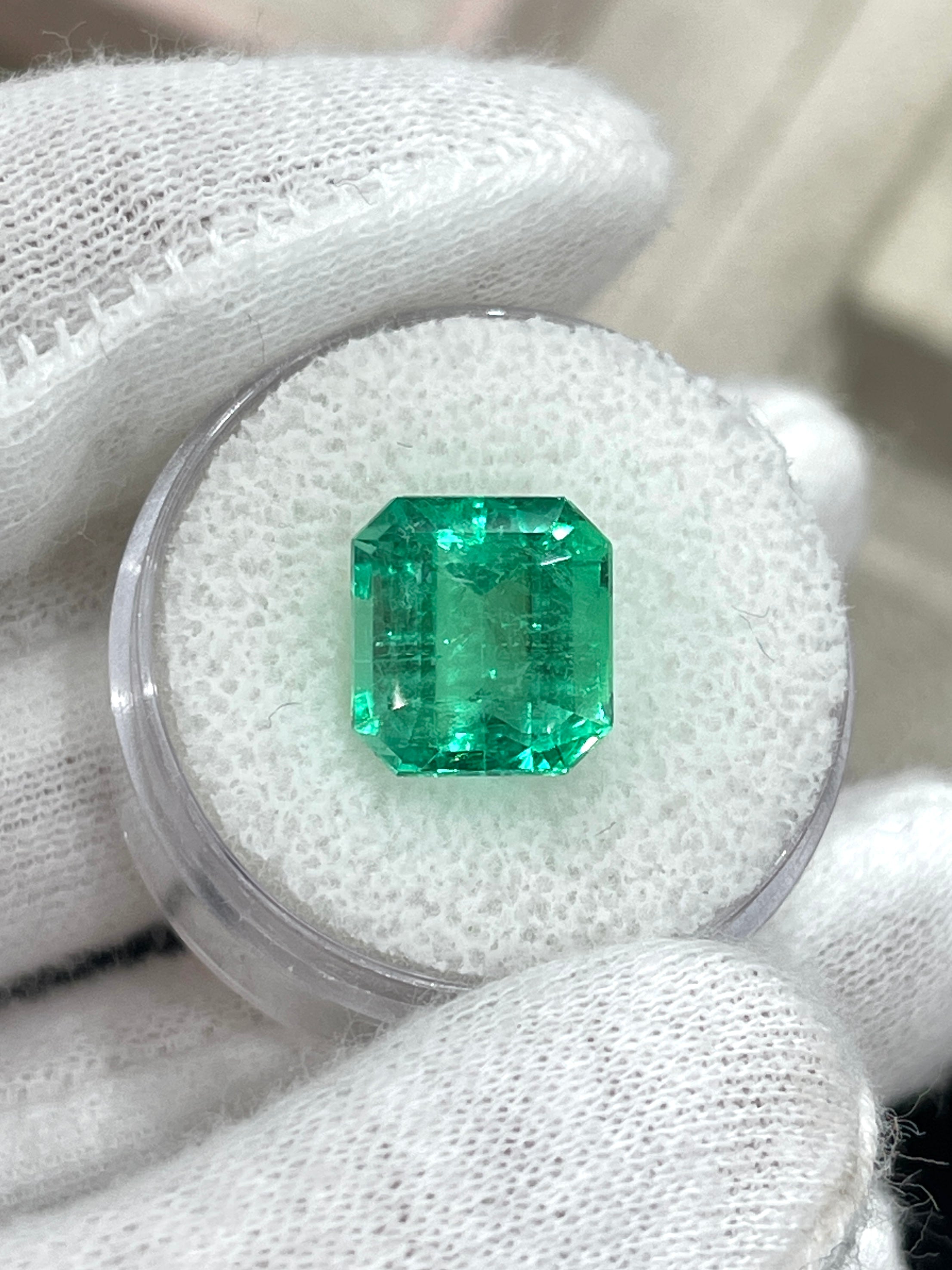Yellowish green 6.07 carat natural Colombian emerald loose gemstone with Asscher cut, showcasing its vibrant color and clarity.